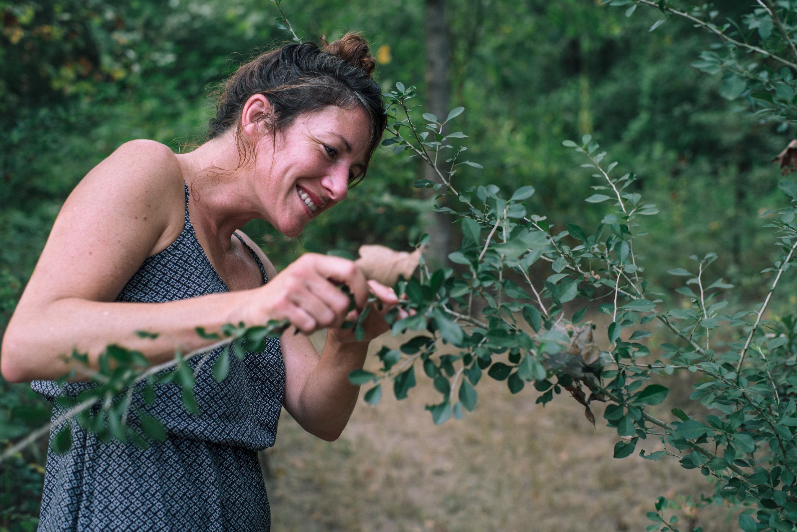 My friend nerding out on bugs and plants in the yard.