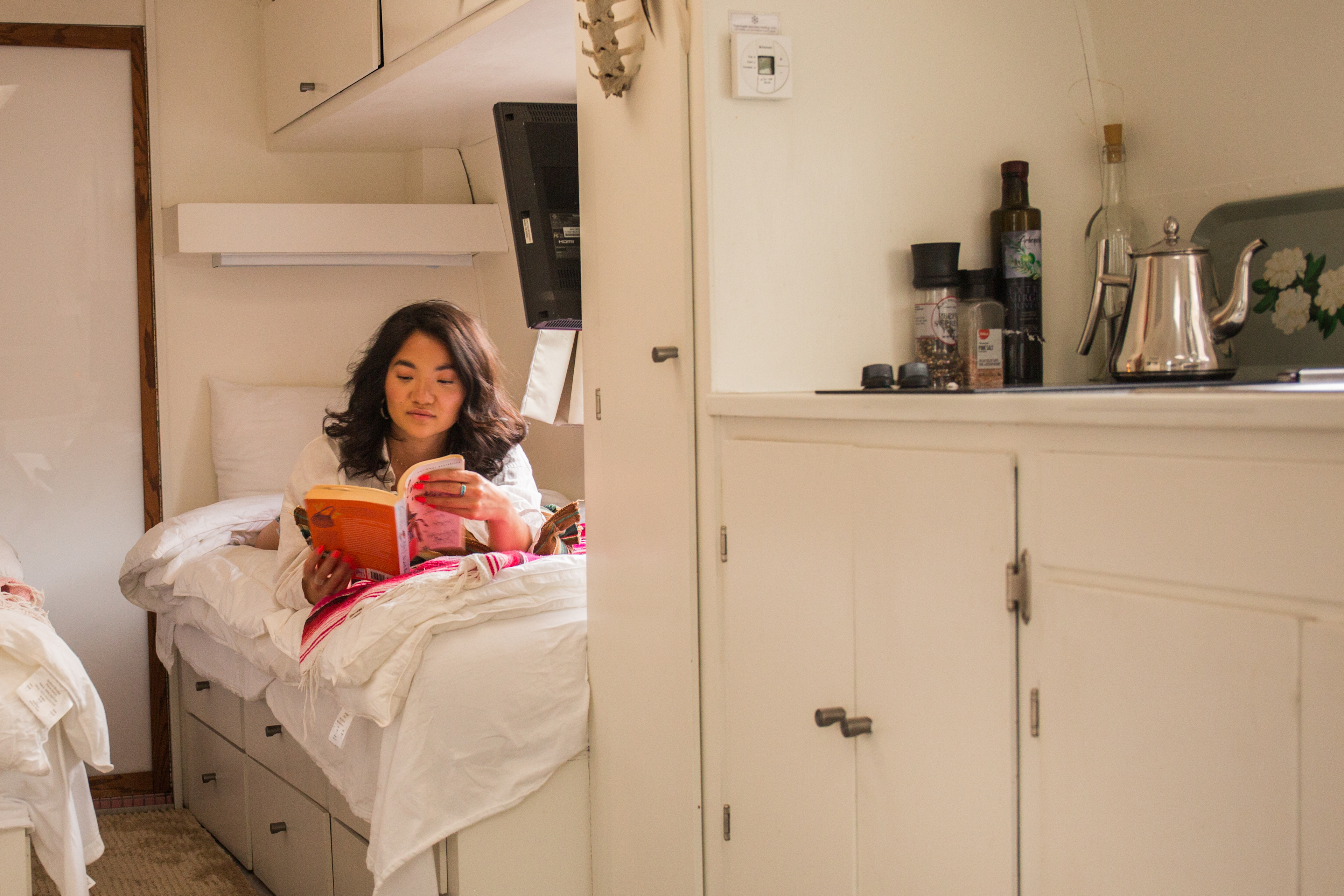 Comfy beds and a monitor for a prime glamping experience. 