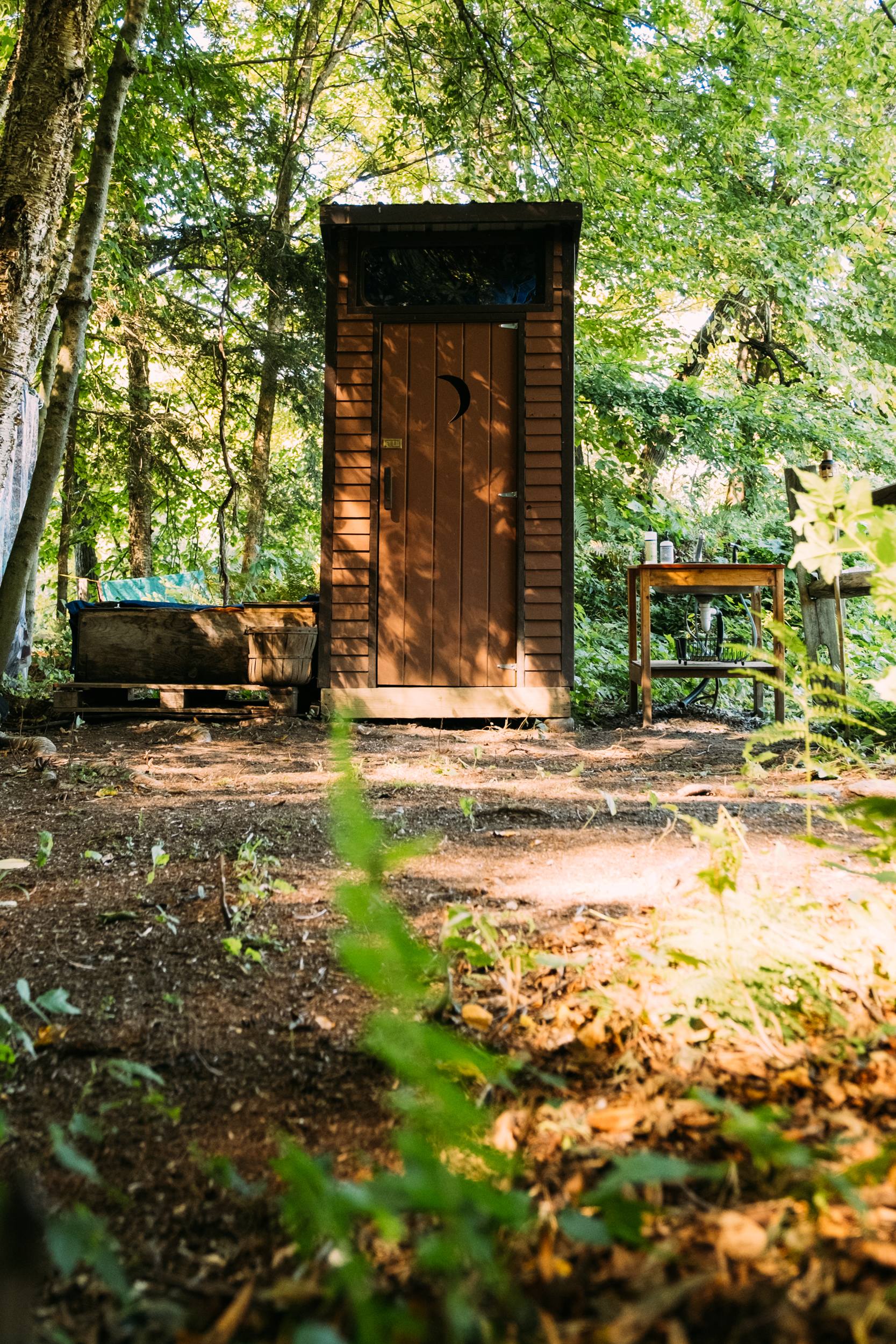 The outhouse and outdoor sink with potable water