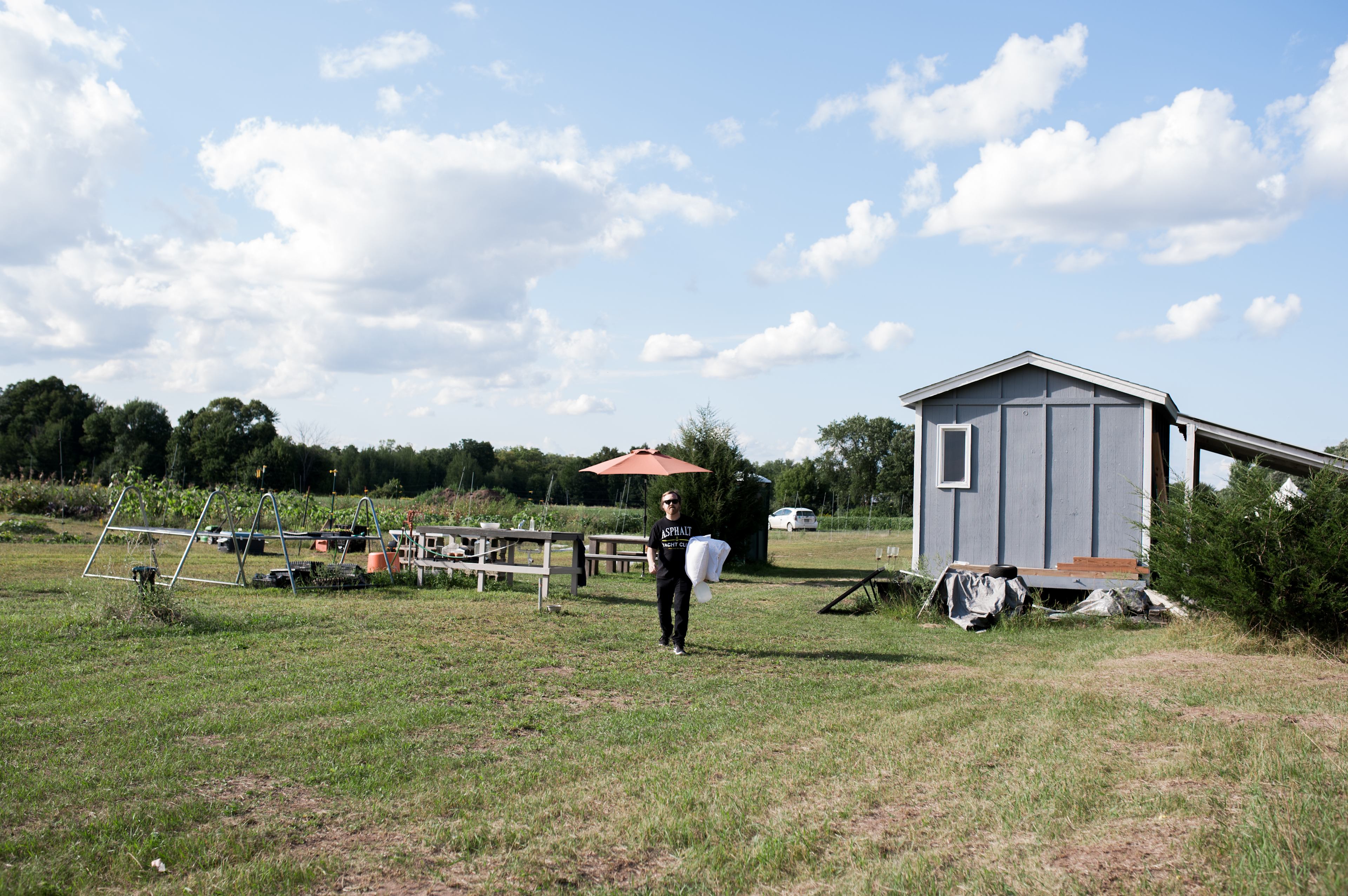 Brining pillows over to the campsite. Looking back at the farm from the campsite you can see Kelsey's cabin, the food prep and wash areas and some of the vegetable fields.