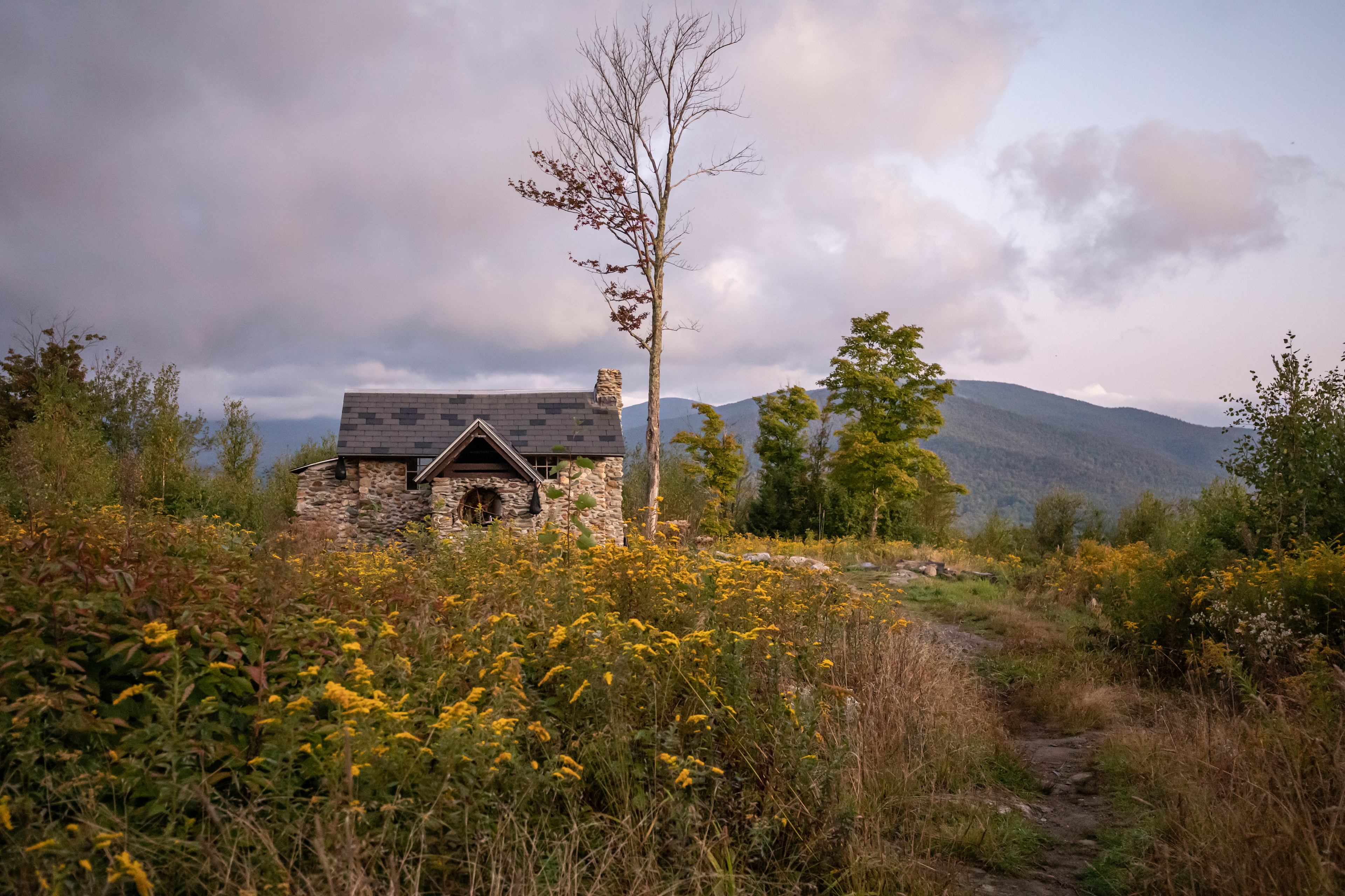 looking back at the cabin from the outhouse trail during sunrise