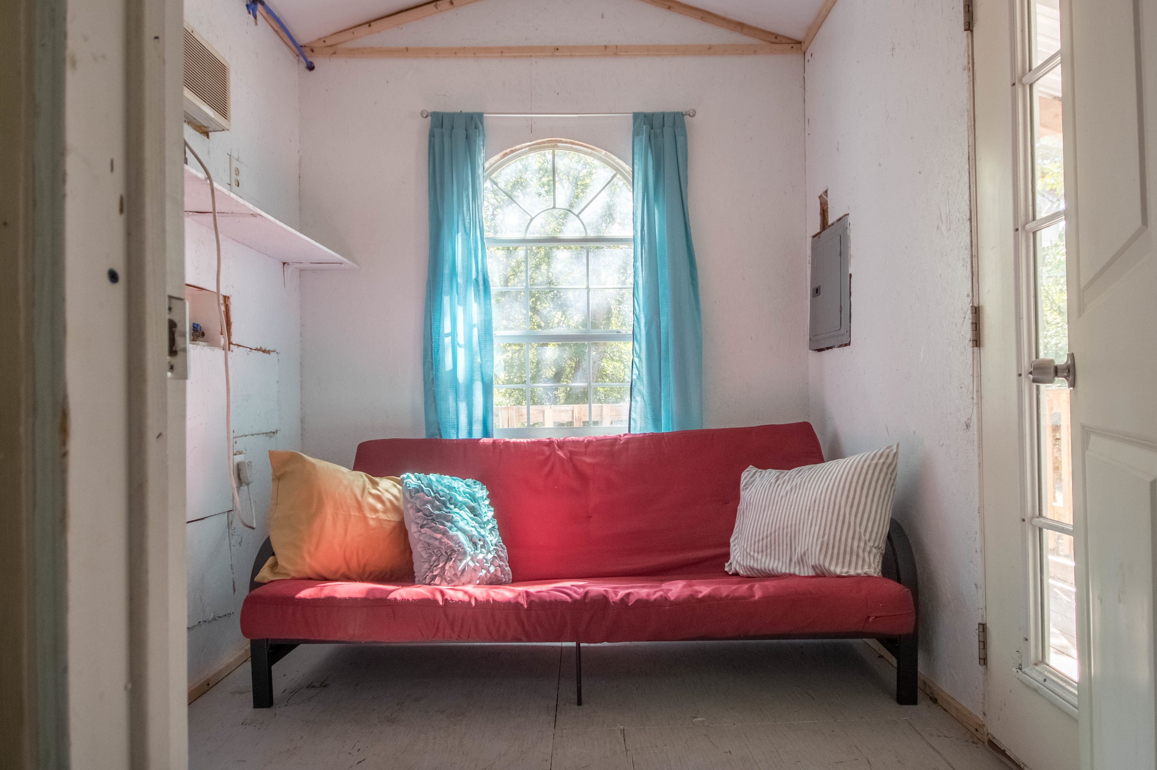 The top story had a futon and beautiful natural lighting