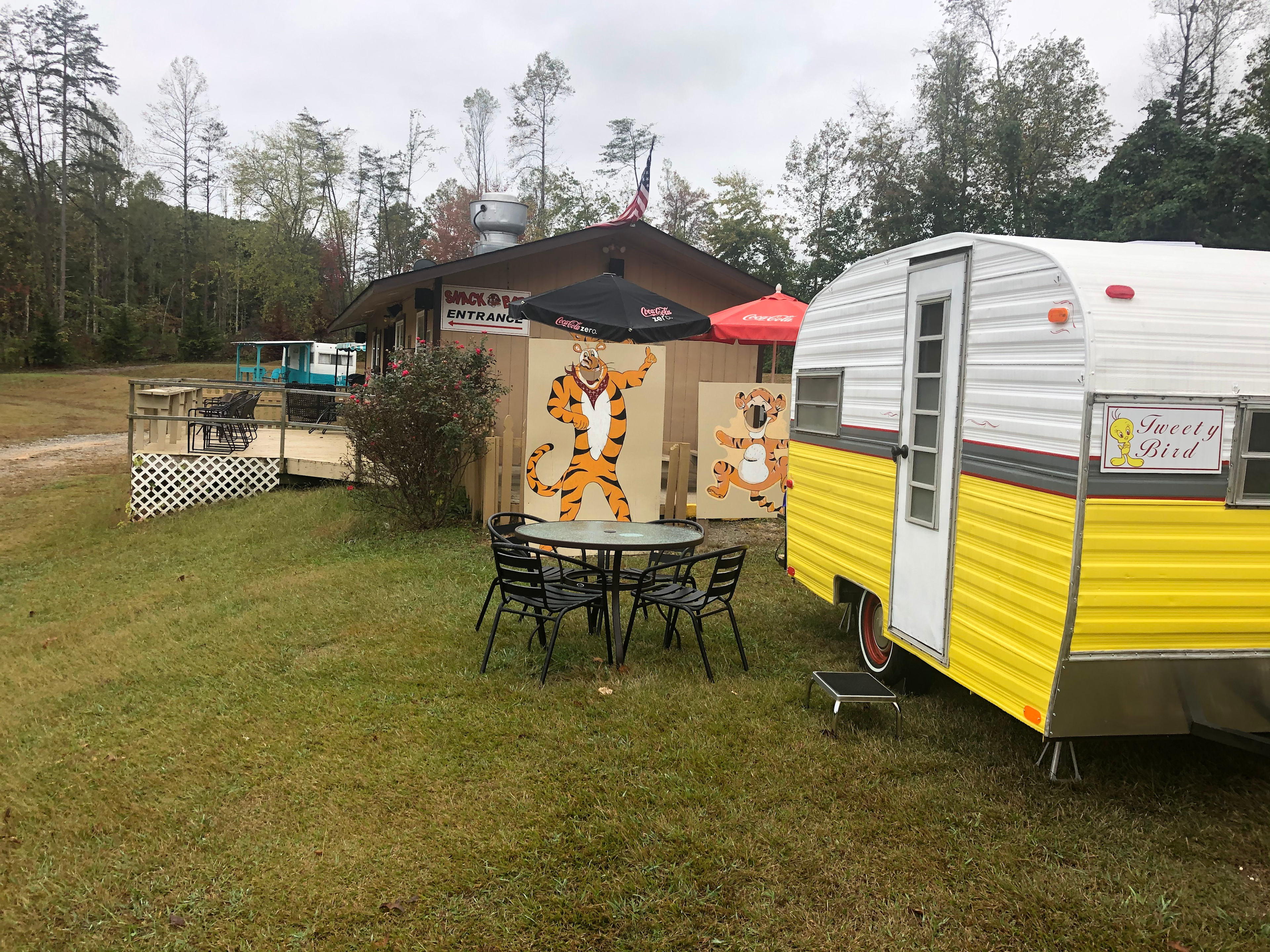 Tweety Bird camper with restaurant in the back ground