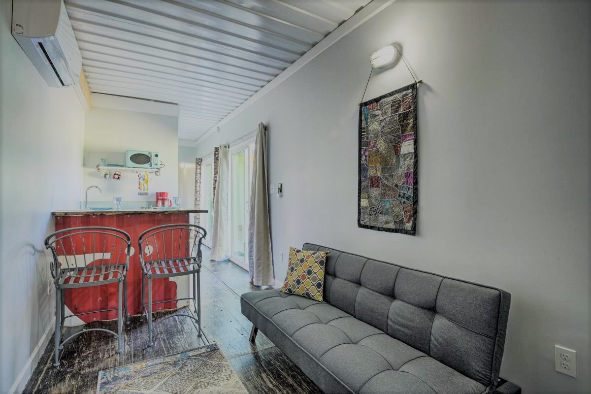 Living area with live edge wood bar and futon