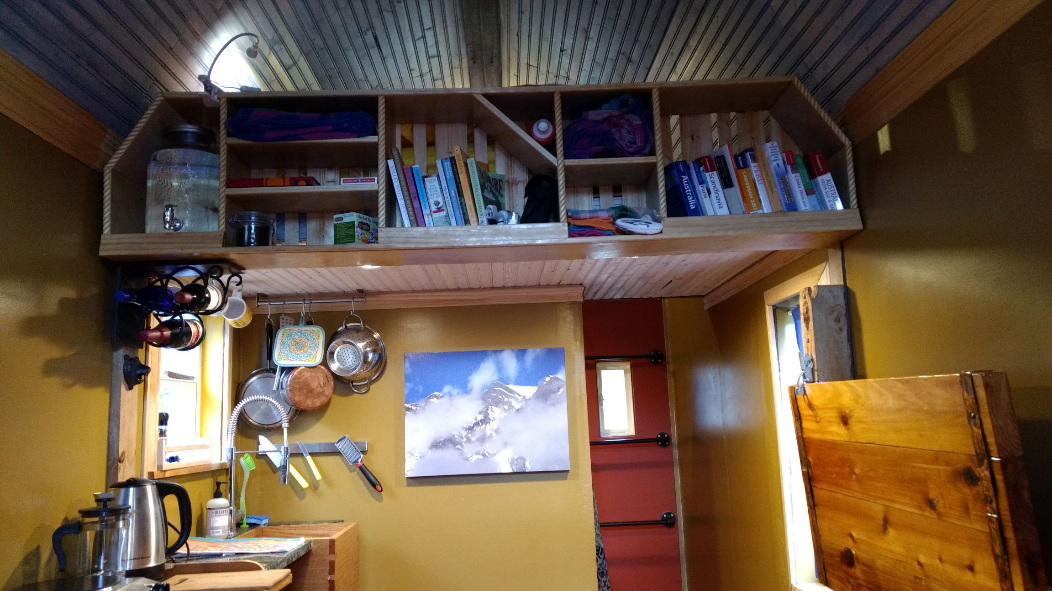 Bookshelf looking up toward sleeping loft