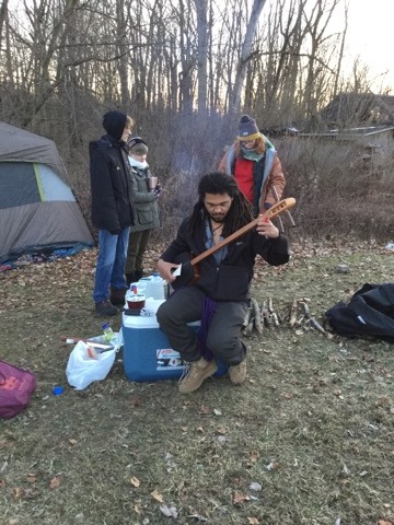This photo are camping here at SCA, playing music,making dinner,keeping warm by the fire and just talking over a cup of hot something.. 