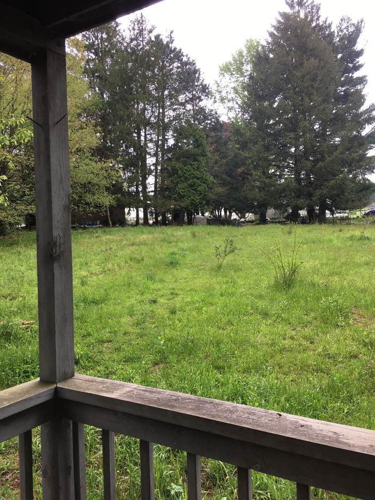 View from the cabin's front porch looking toward our house