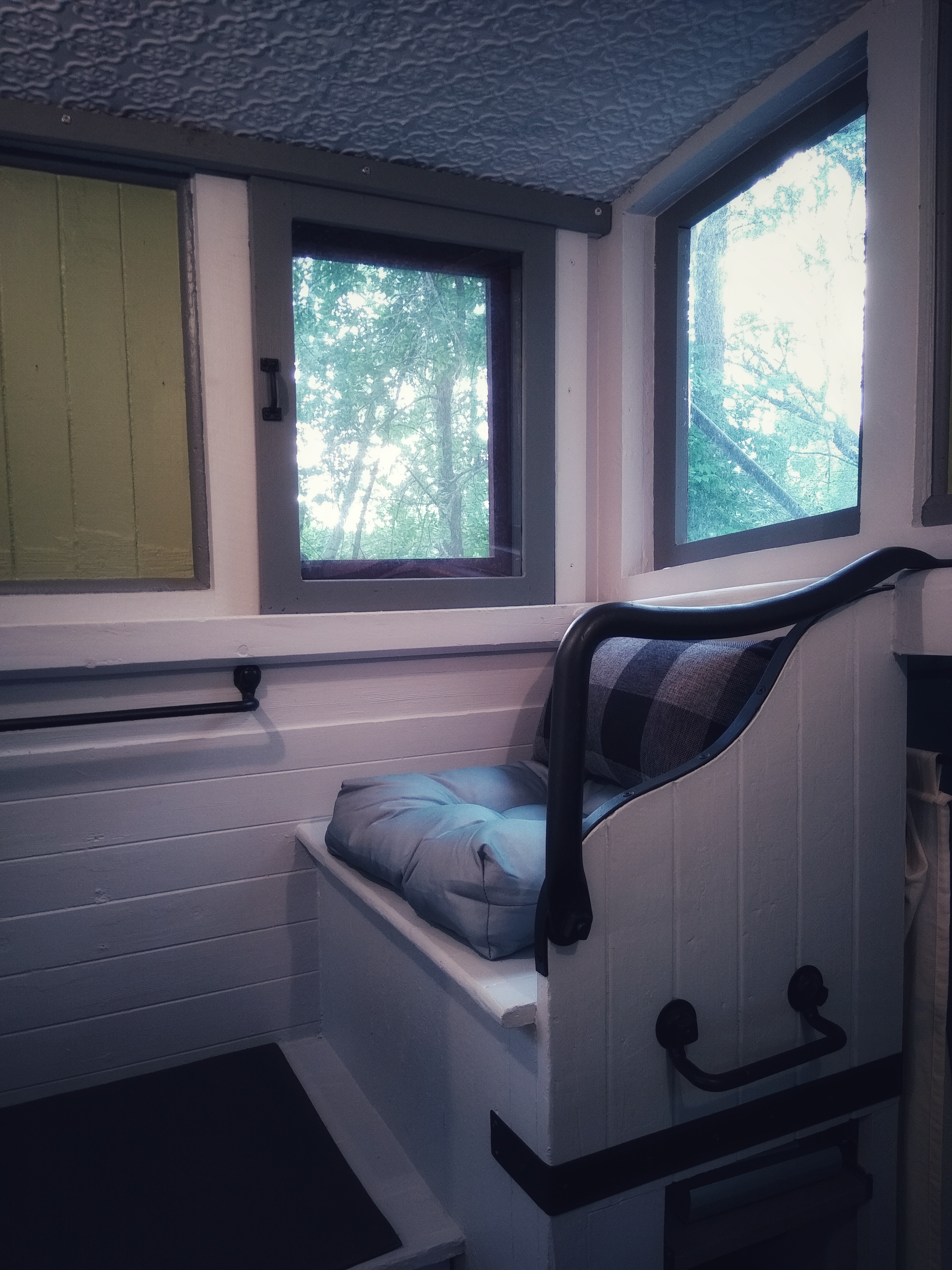 The cupola with cushions for reading and a unique tin ceiling.