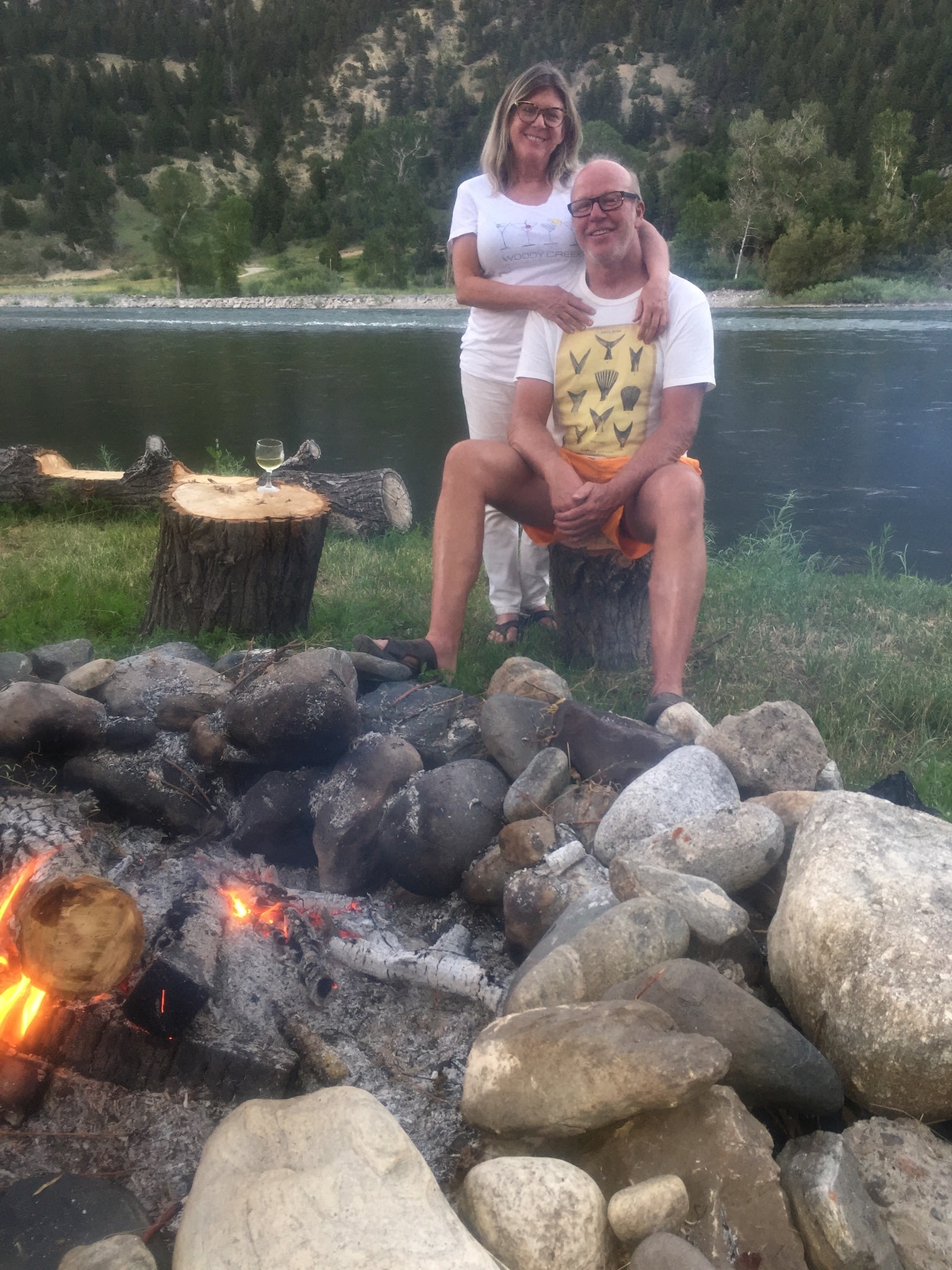 We are sitting at the campfire in front of our wooden deck on the Yellowstone River.