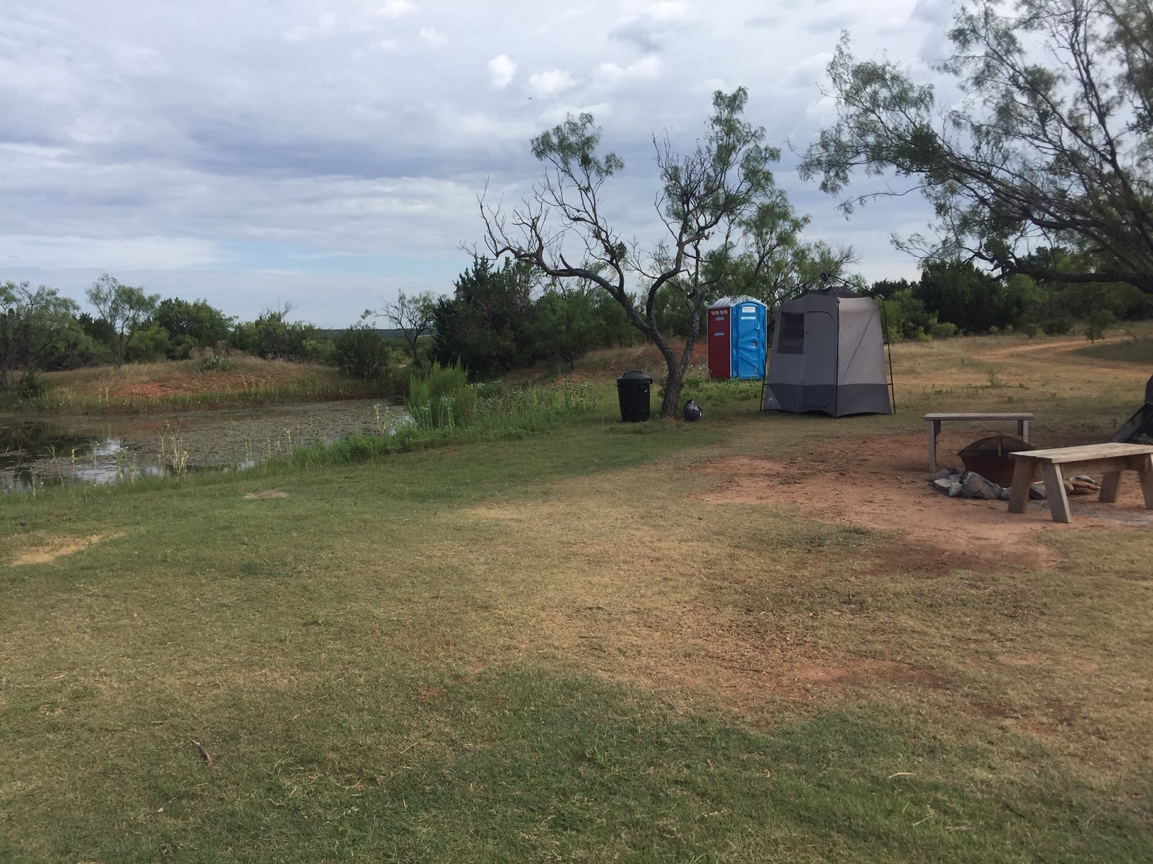 Tent Pad area, camp shower tent and restroom 