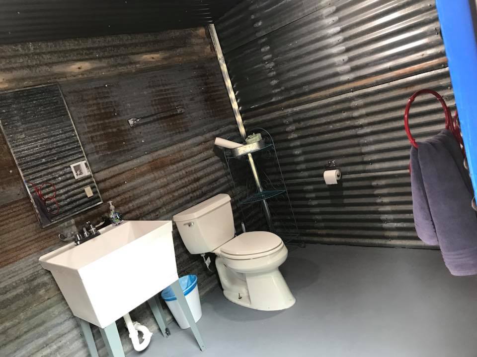 Toilet and sink in the bath house