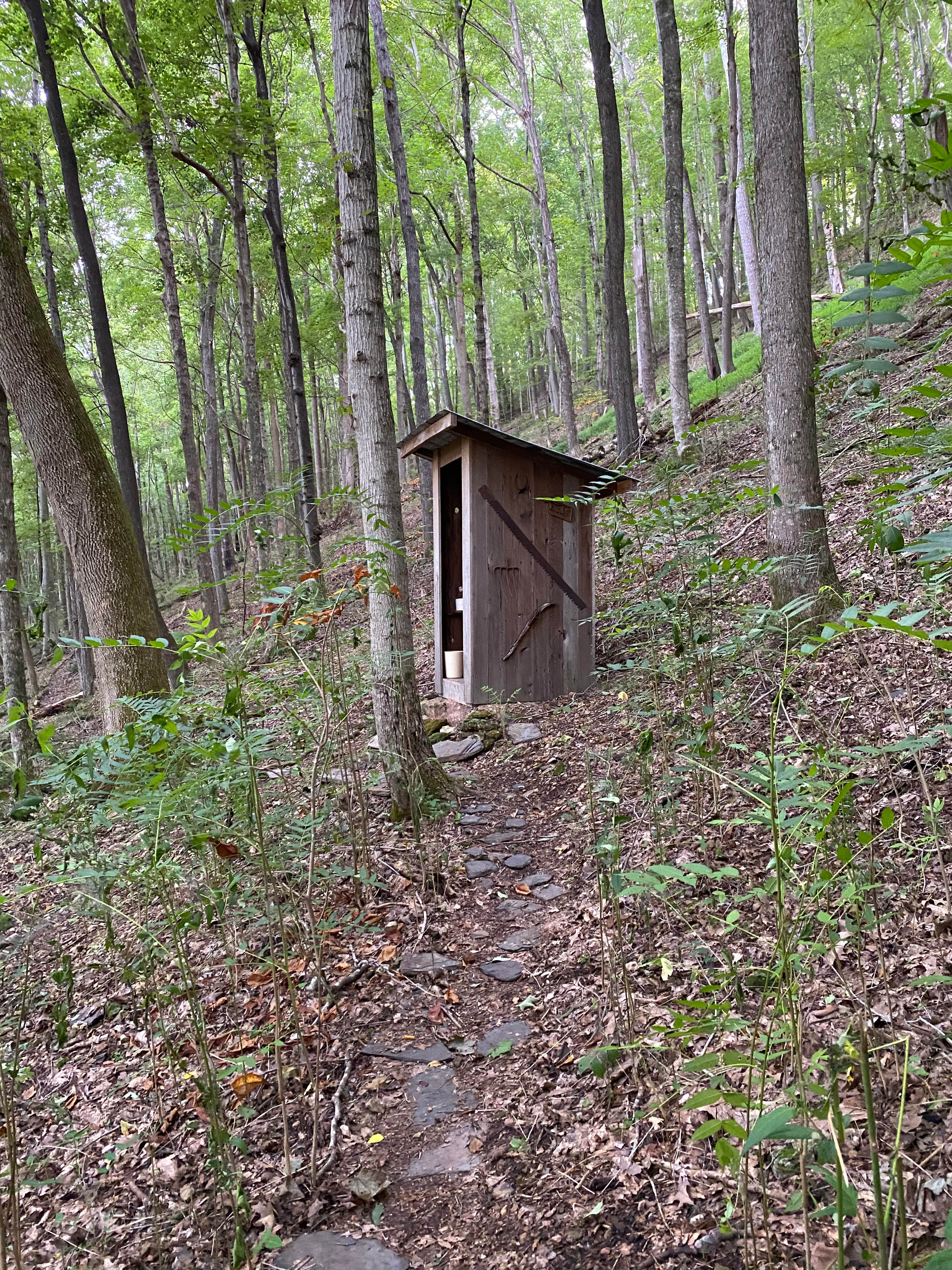 Clean and comfortable outhouse with a lovely view