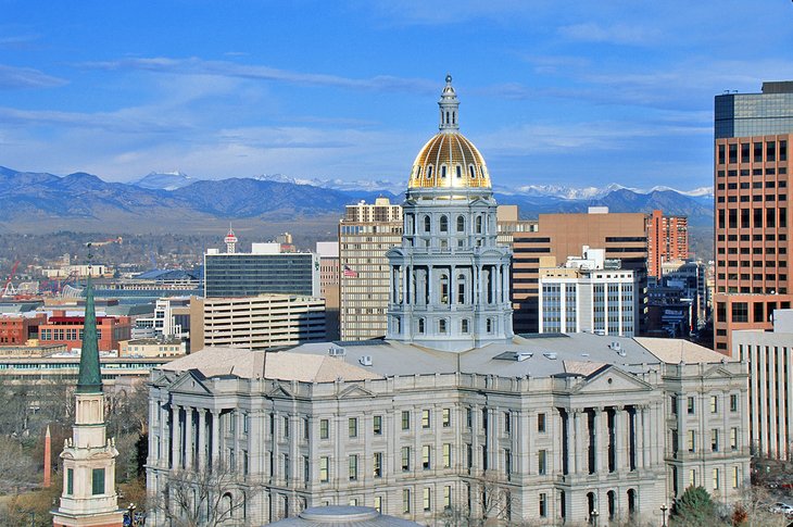 Denver Capitol building with Rocky Mountains in background.
