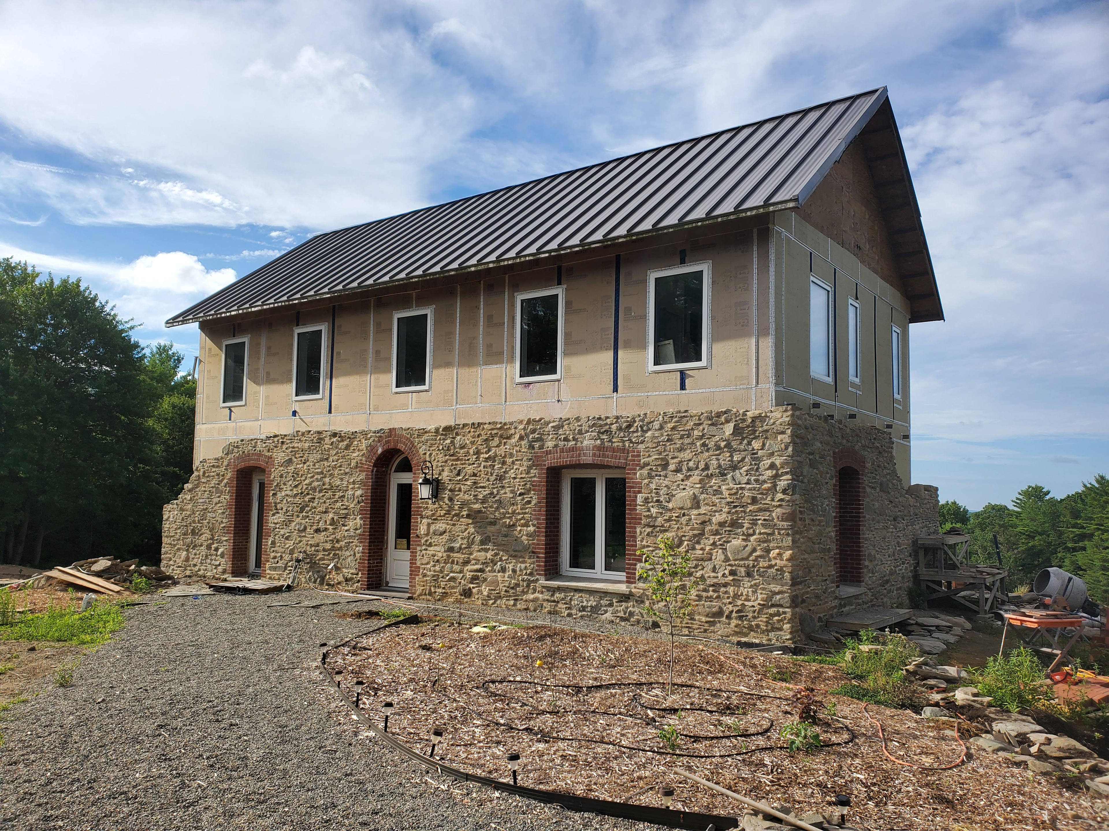 This is the stone house that is under construction on the outside but fully finished on the inside next to where you will park your car and we meet.  A restroom is available and fully sanitized for your use being mindful of Covid concerns prior to hiking in.