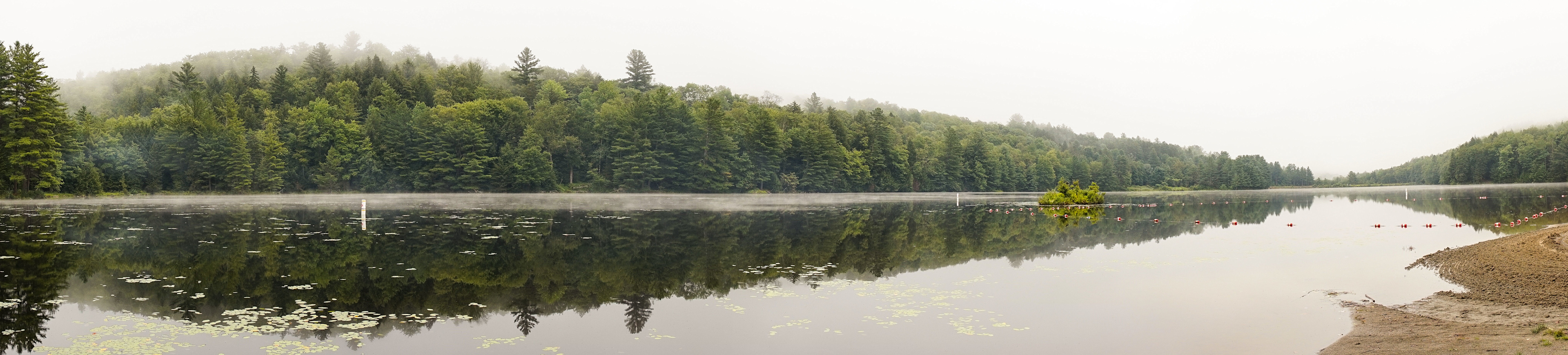 View from beach across Black River Pond. Panoramic