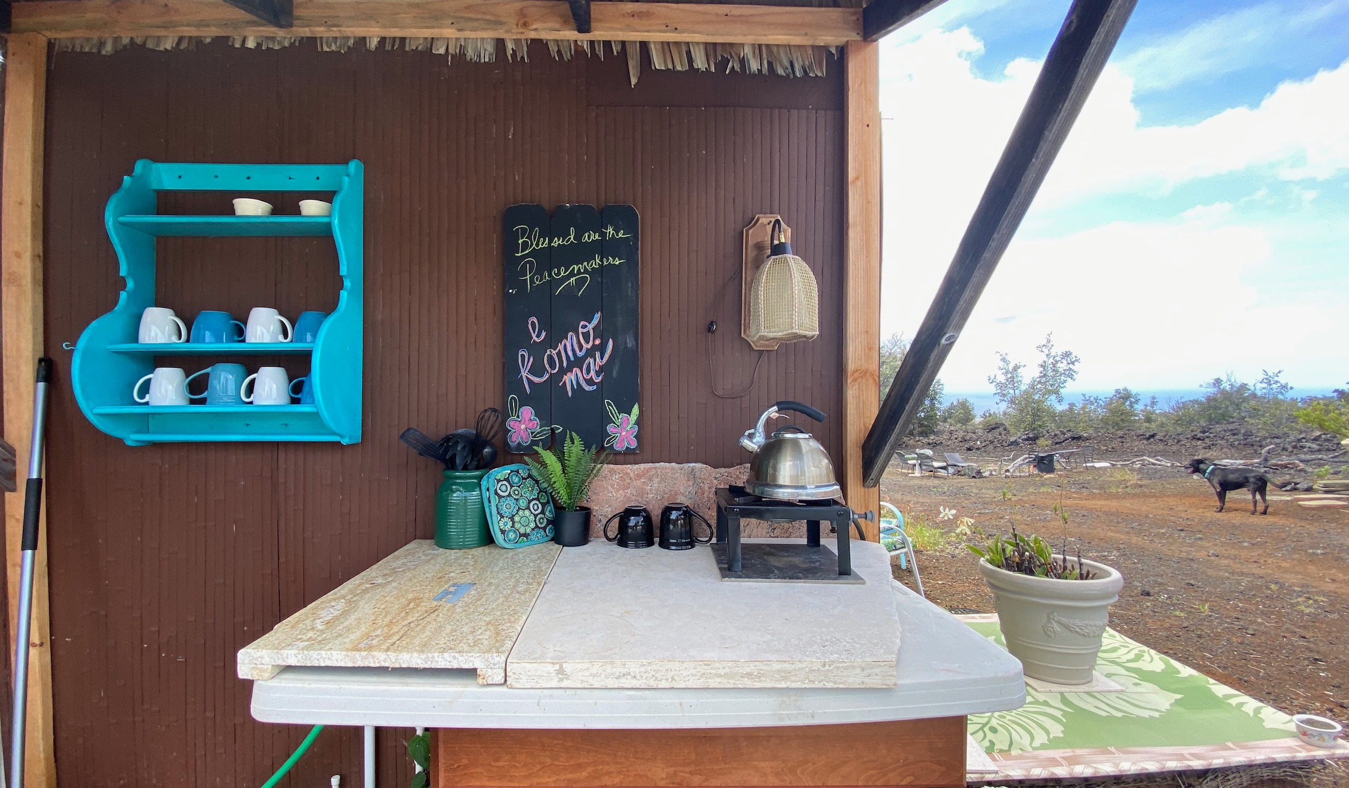 kitchenette with propane burner and kitchenware