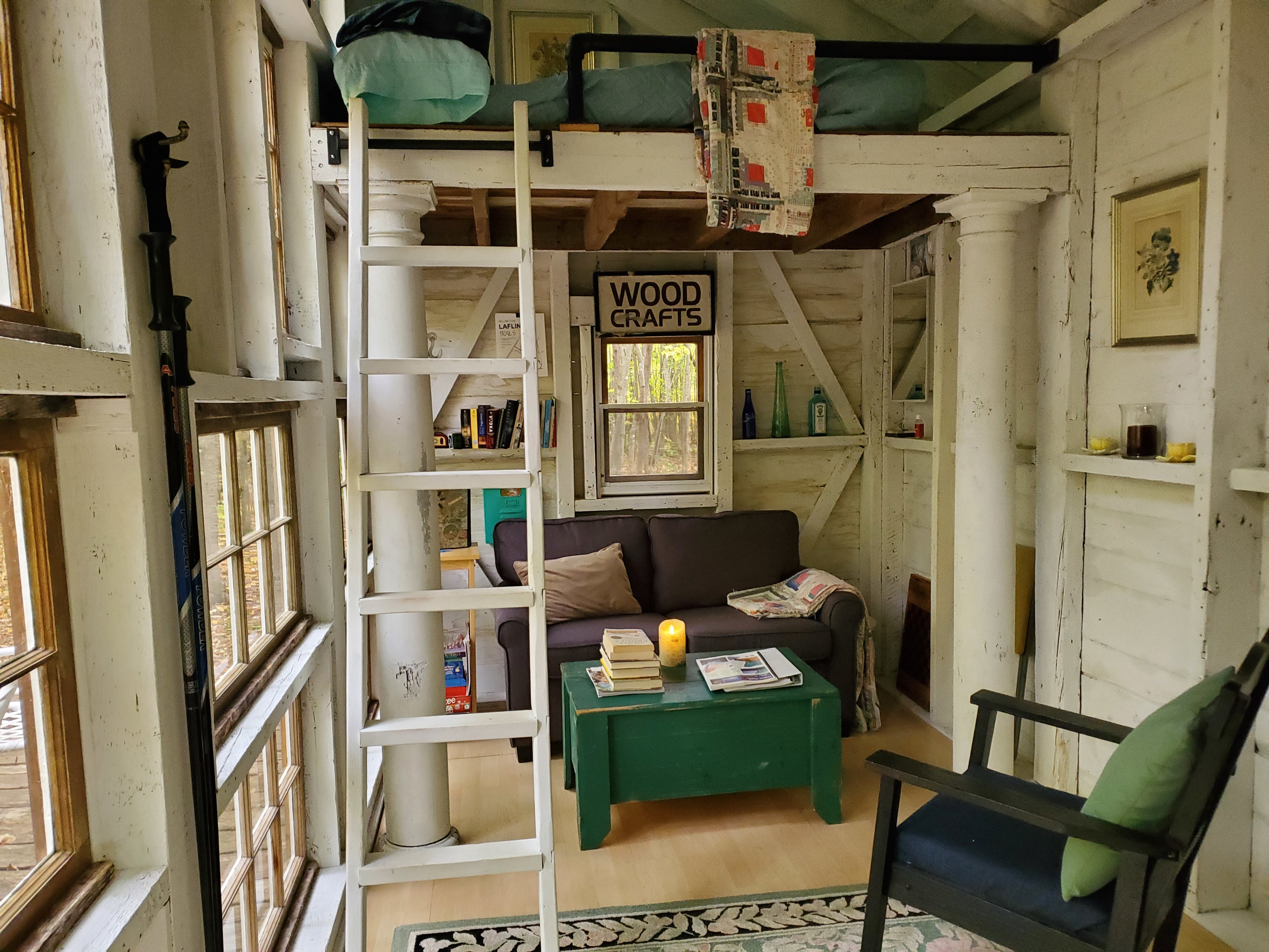 The ladder hangs on the wall when not in use leaving plenty of room to spread out.