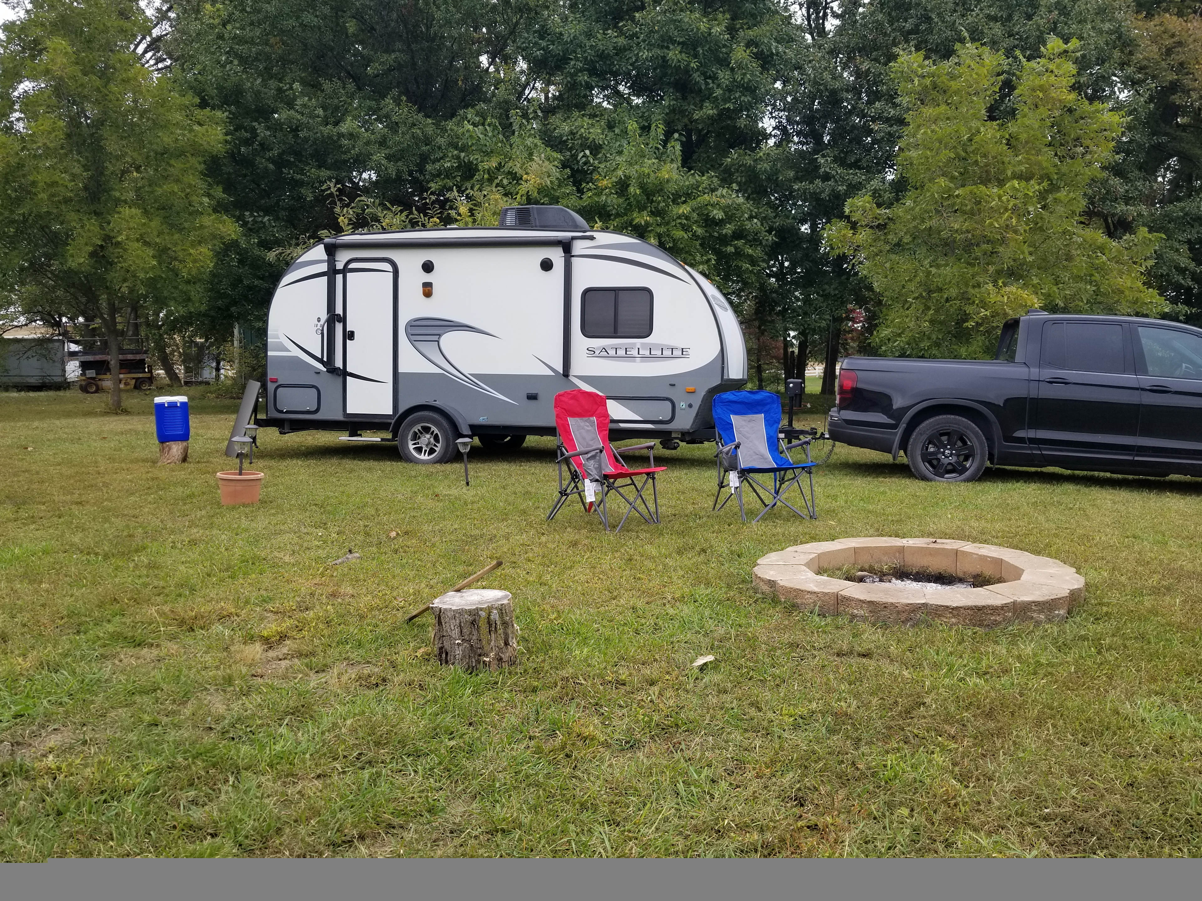 Orchard electric site with personal firepit