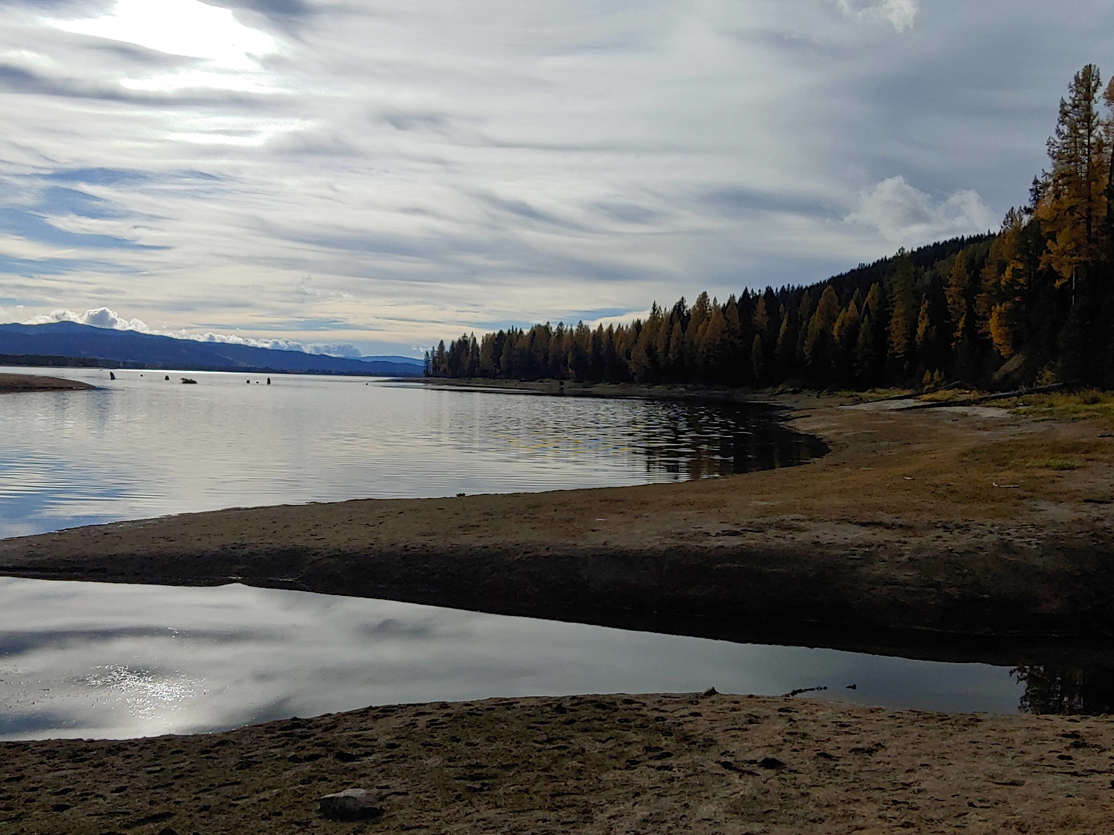 Lake Cascade in the morning light. You can see the mouth of the creek in the foreground. In spring it is under water, but in the fall the lake drops low low enough to see it.