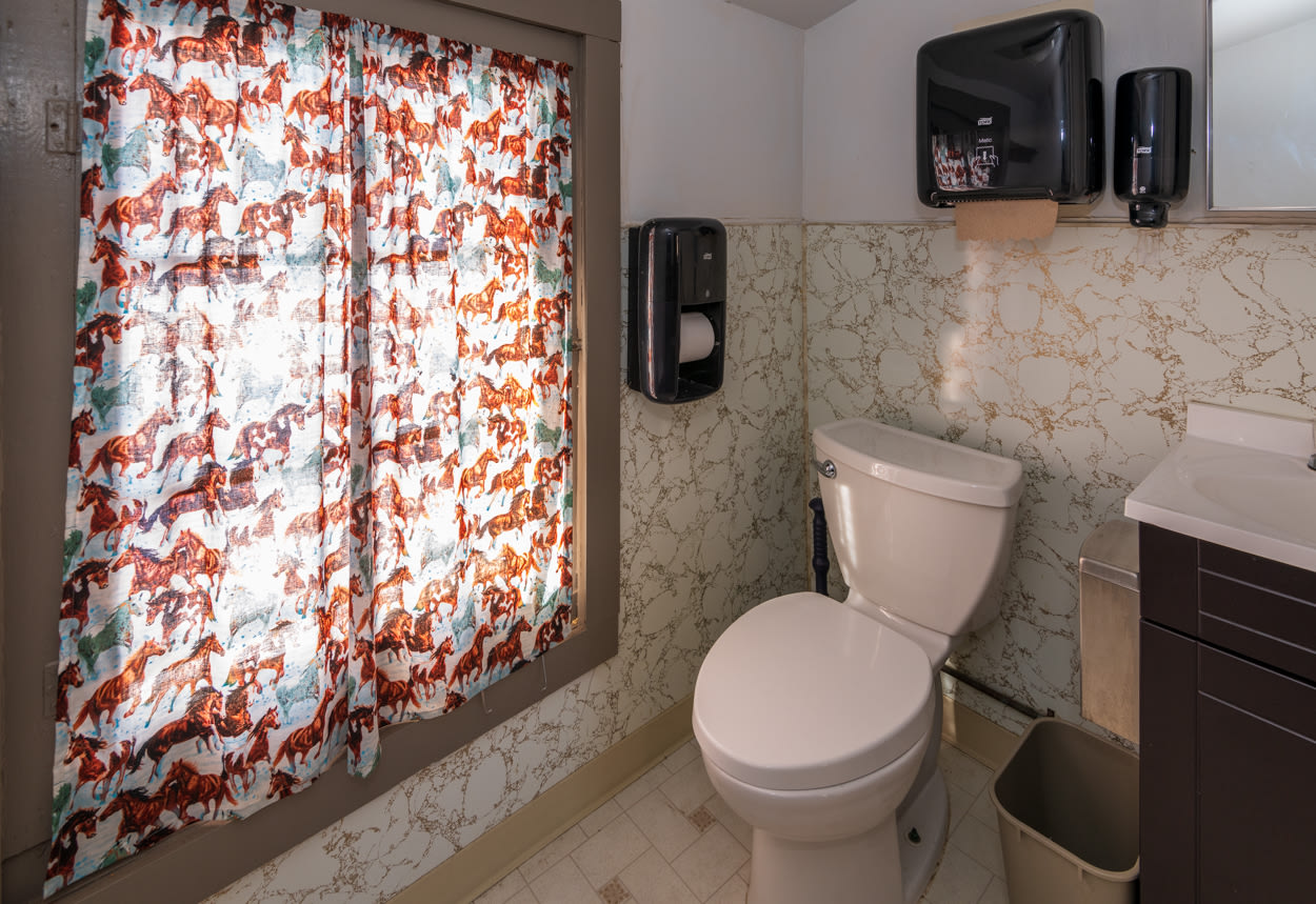 2 bathrooms available, each with a shower, sink, and toilet.