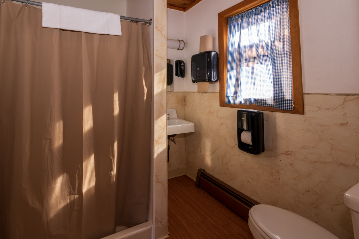 2 bathrooms available, each with a shower, sink and toilet.