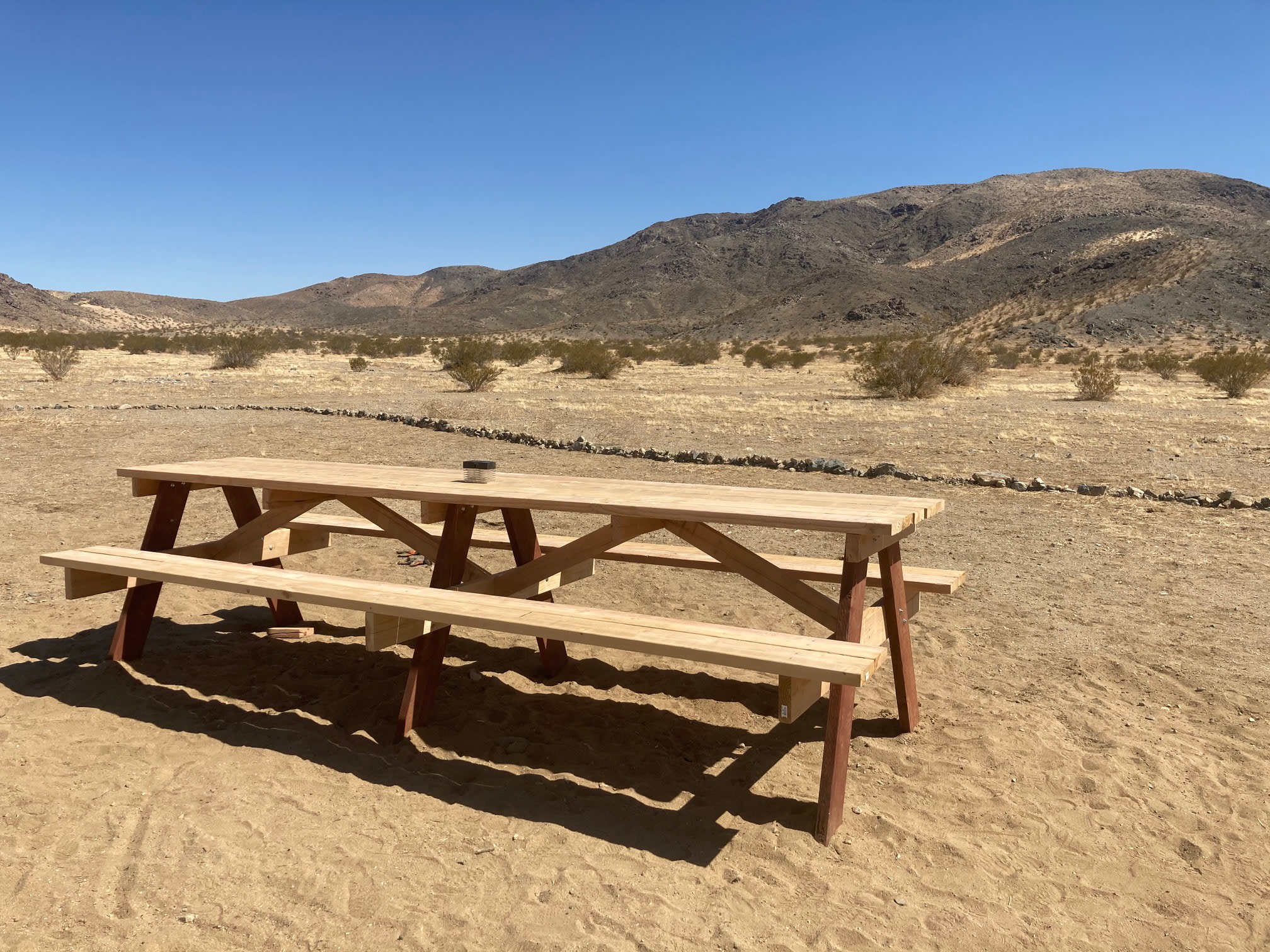 Here's the brand new, 12-foot picnic table handcrafted by Mar.