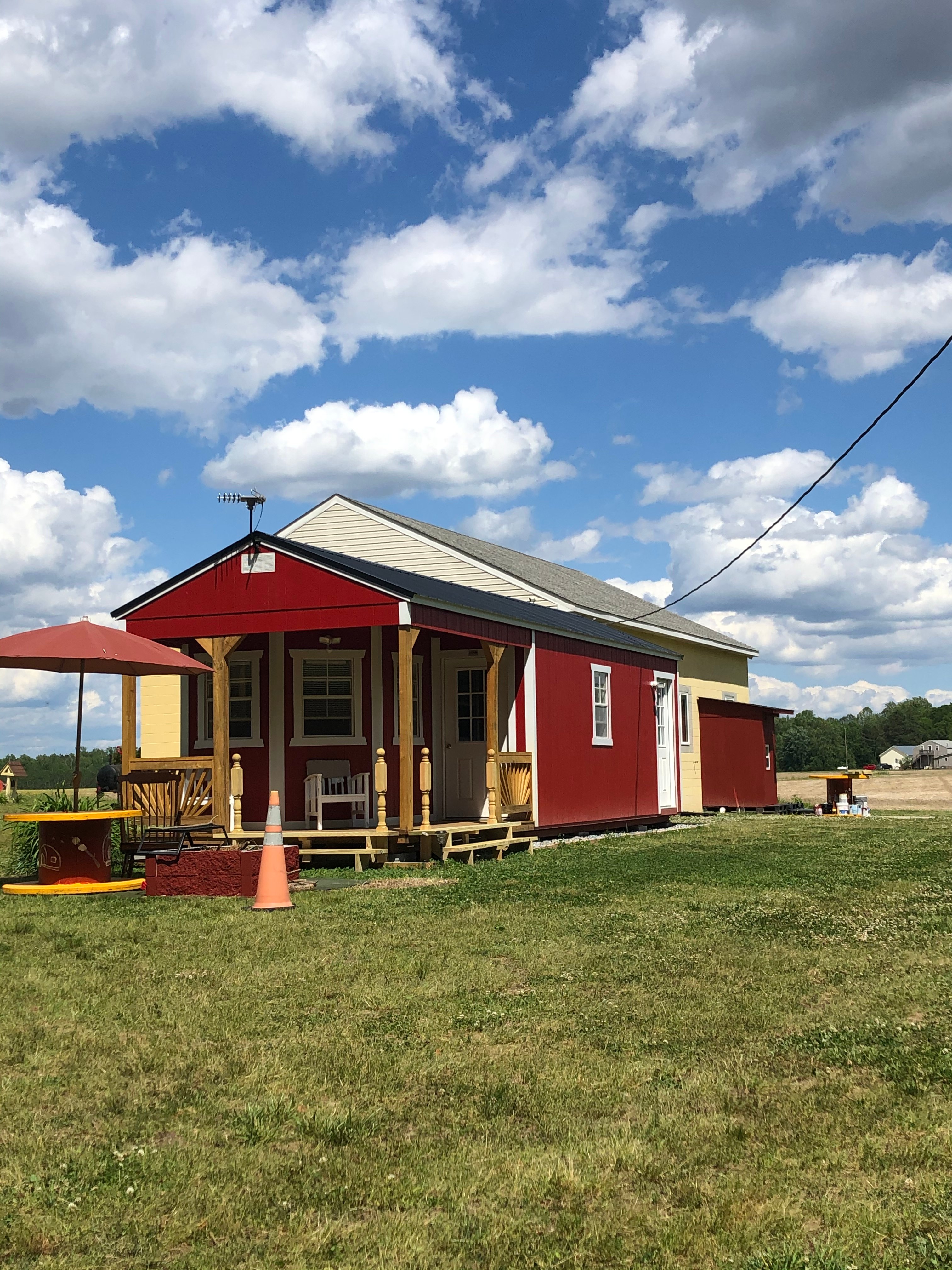 Side view with umbrella and fire pit
