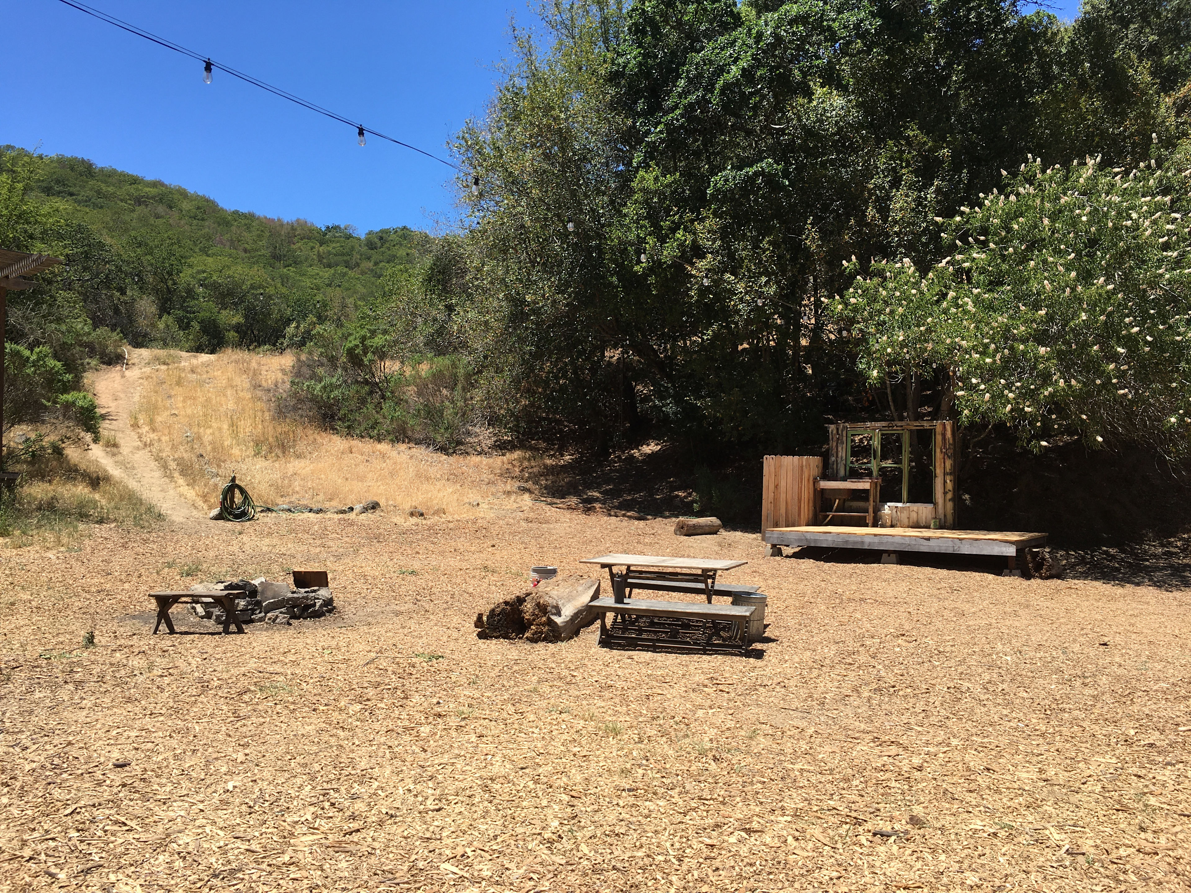 Drinking water available at the sink on the platform as well as at the hose to the left (bottom of the hill!)
