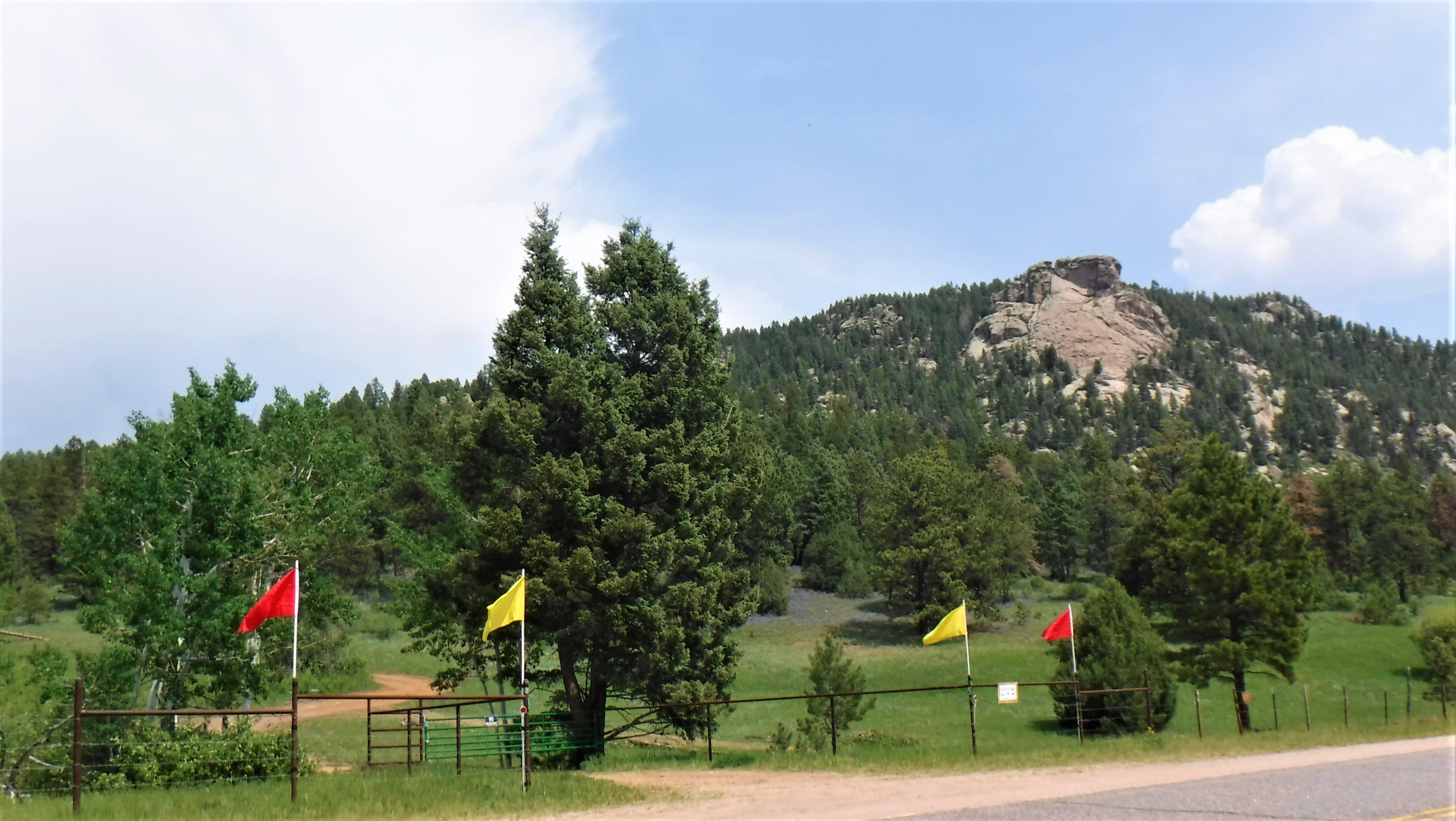 Little Scraggy Peak and the Camp's front gate, marked with red and yellow flags.