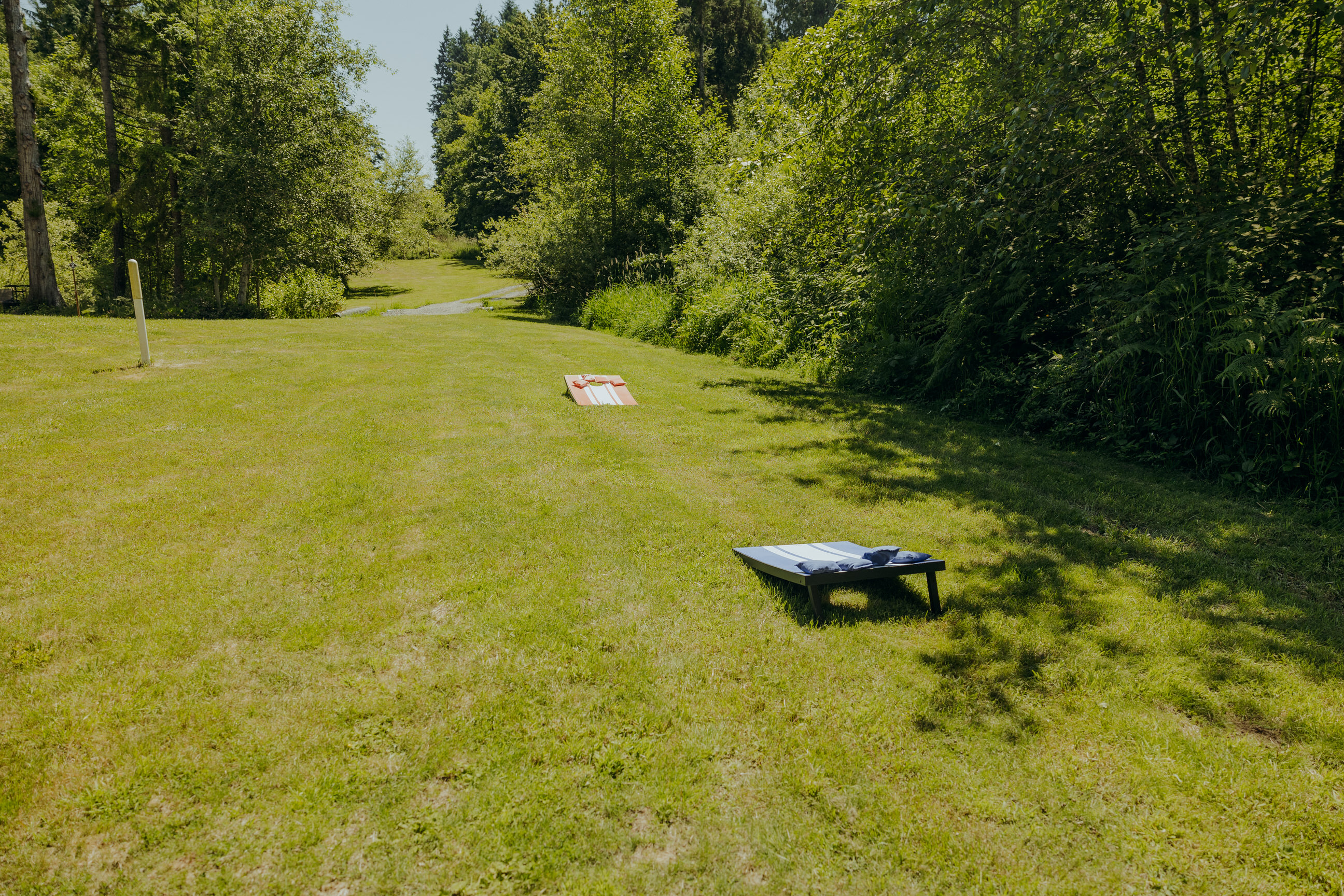 Play field with cornhole.