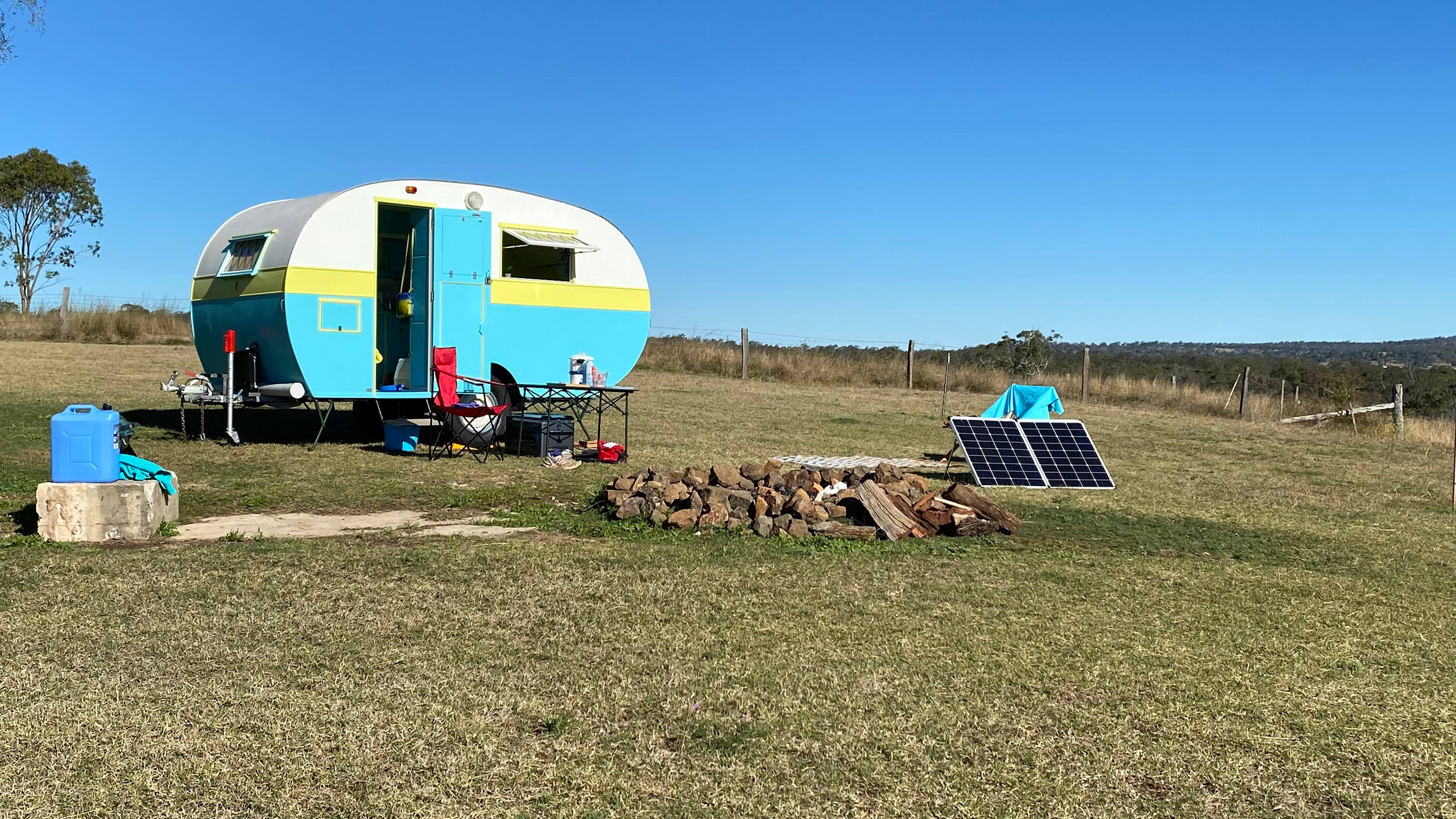 Fire pit with our caravan. Own power and solar makes a big difference