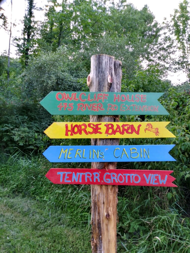 Hand painted directional signs. Lots of places to go on the farm. 