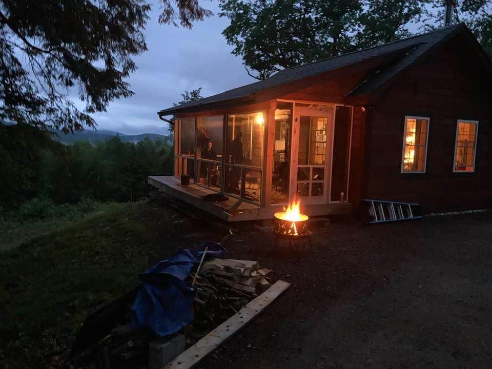 The fire pit, grill, and front porch are available to campers.  Power outlets and small fridge are on the porch.