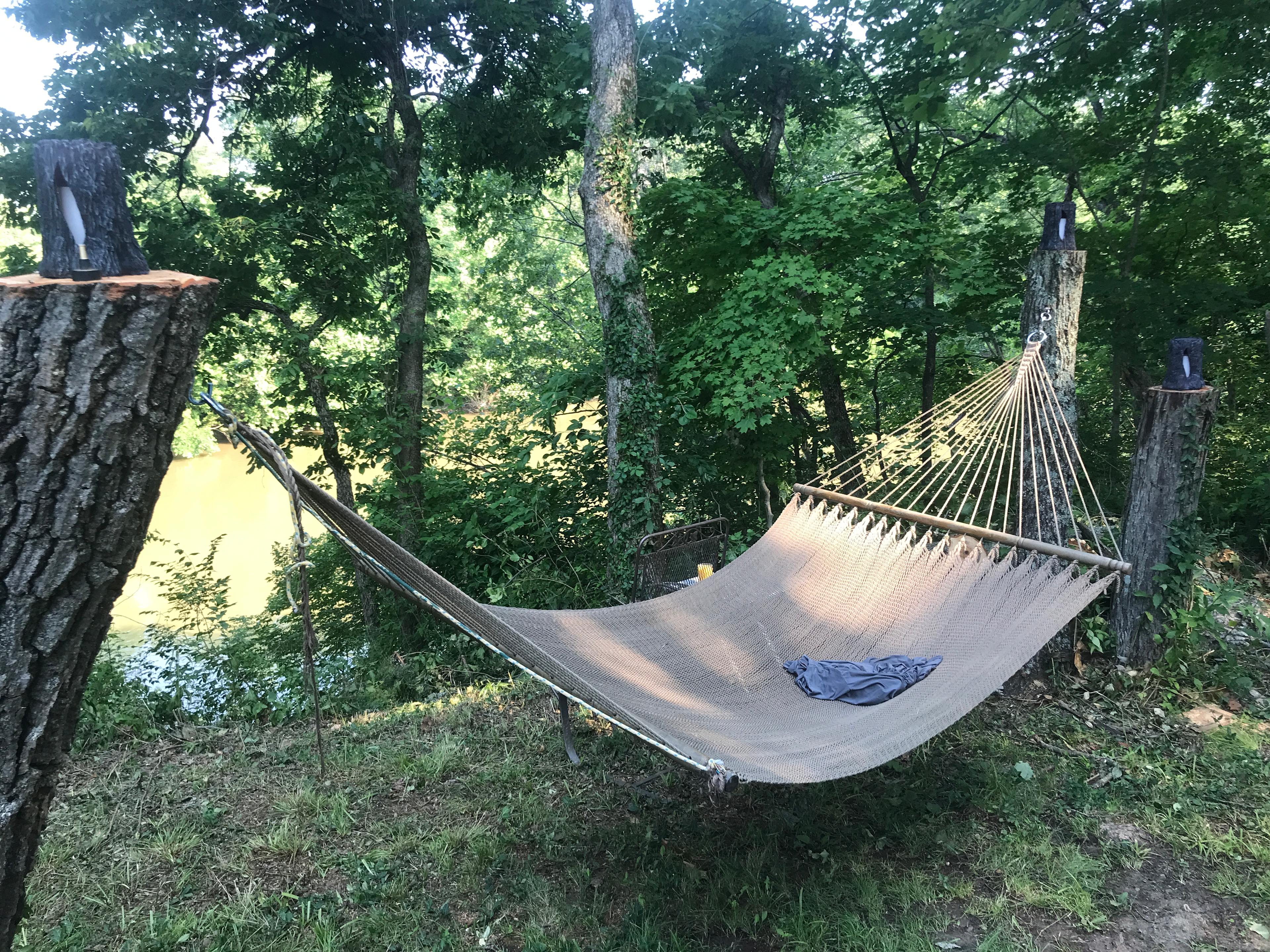 This hammock is up close to my house, but of course you can relax here if you wish. I love watching canoes and kayaks float by on weekends. Or bring your own hammock and string it up in the bottomland where I've kept many trees to be hammock distance apart.