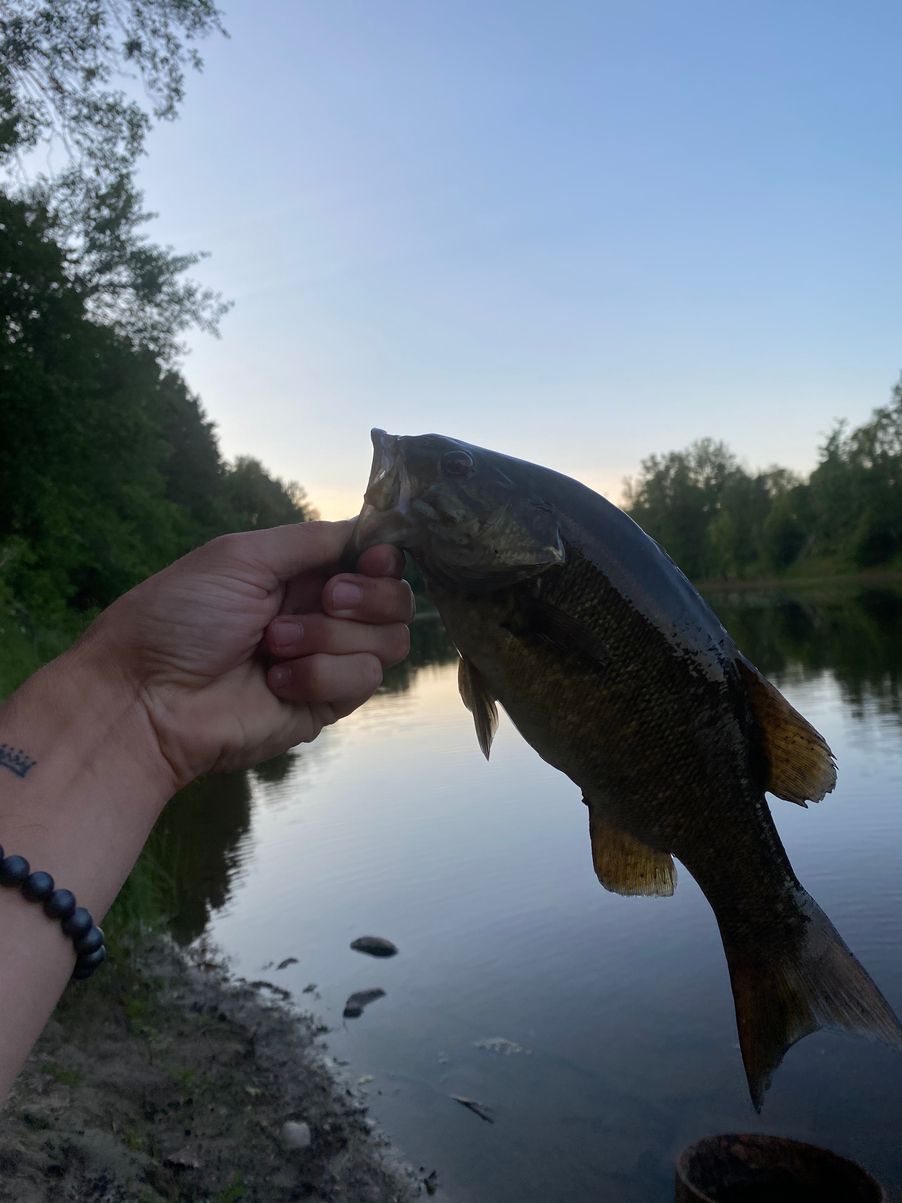 Fishing on the bank of the river from the trail on site 9