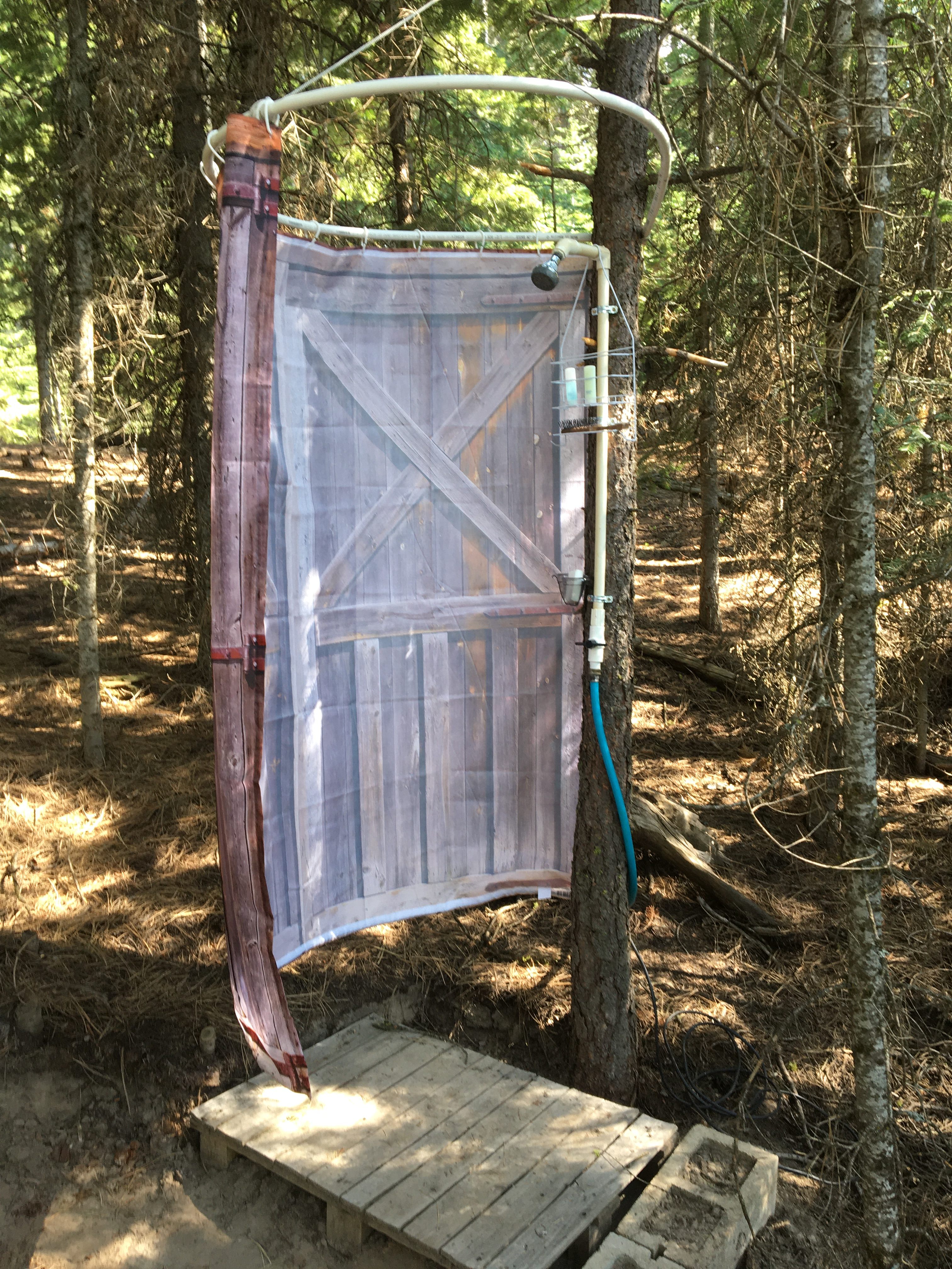 Gravity fed hippie shower in parking common area