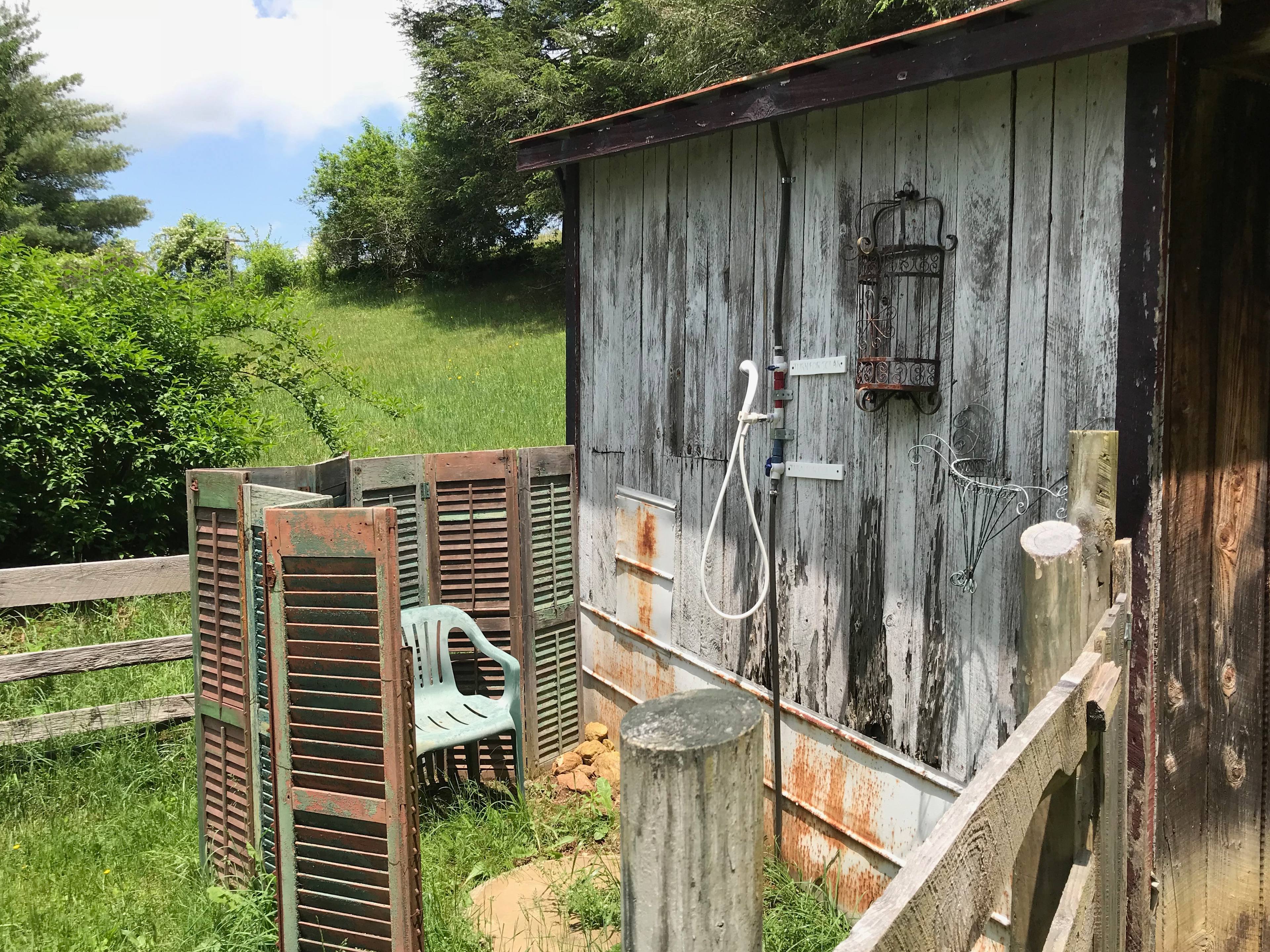 Take a warm shower in this charming rustic outside shower. Towels are included in your stay. 