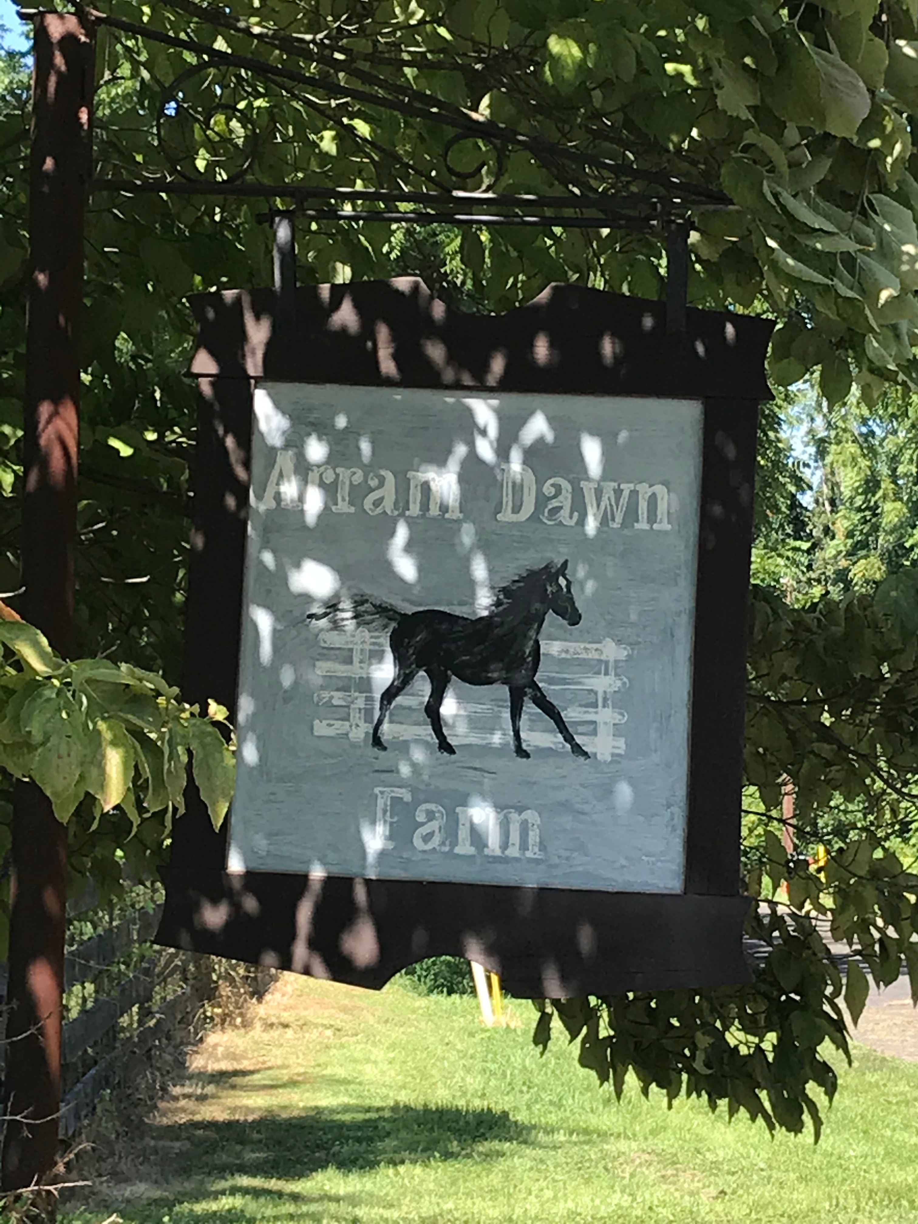At entrance to farm driveway 