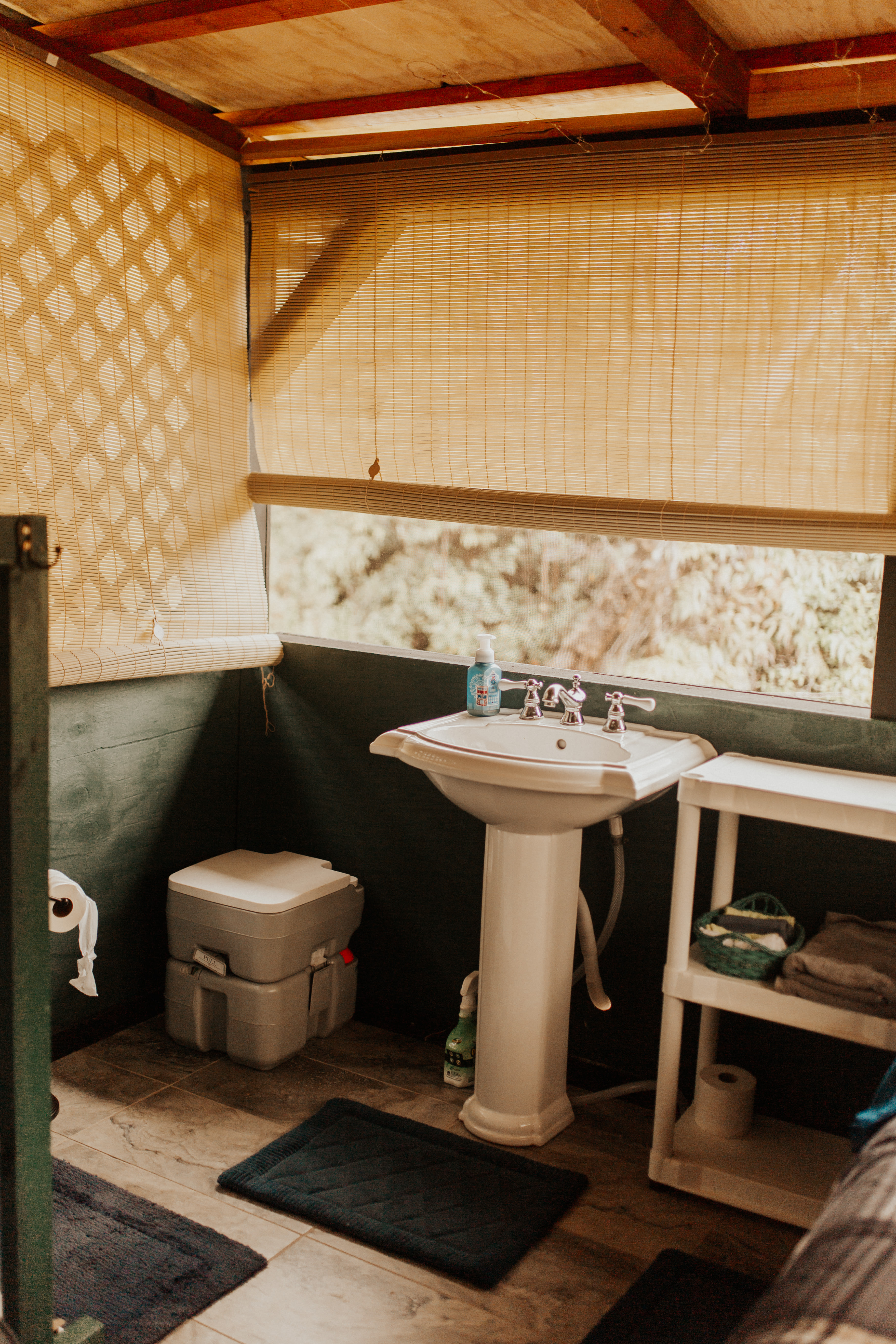sink and small toilet in the first room