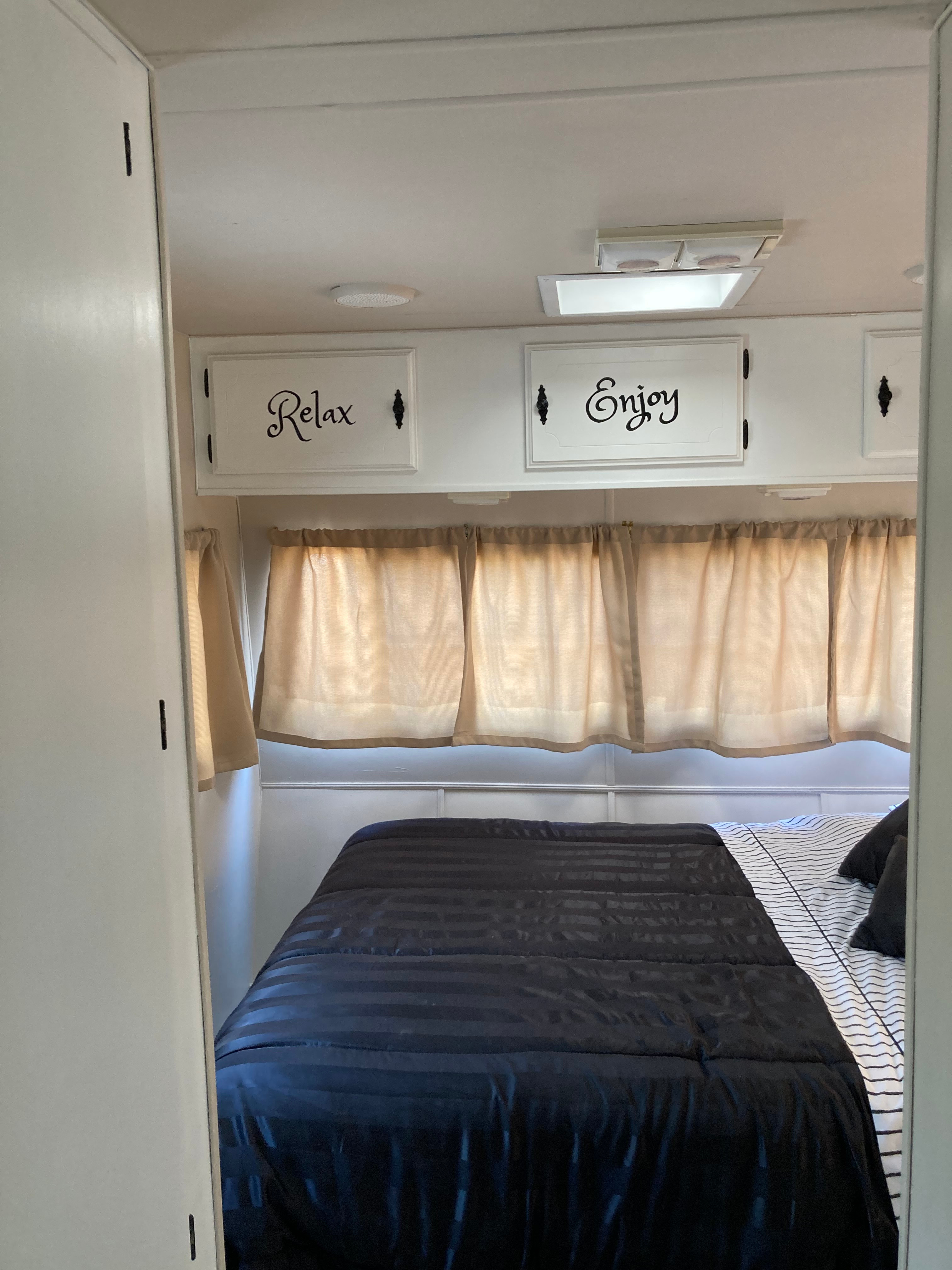 Queen size in the bedroom. Privacy curtain at entrance.