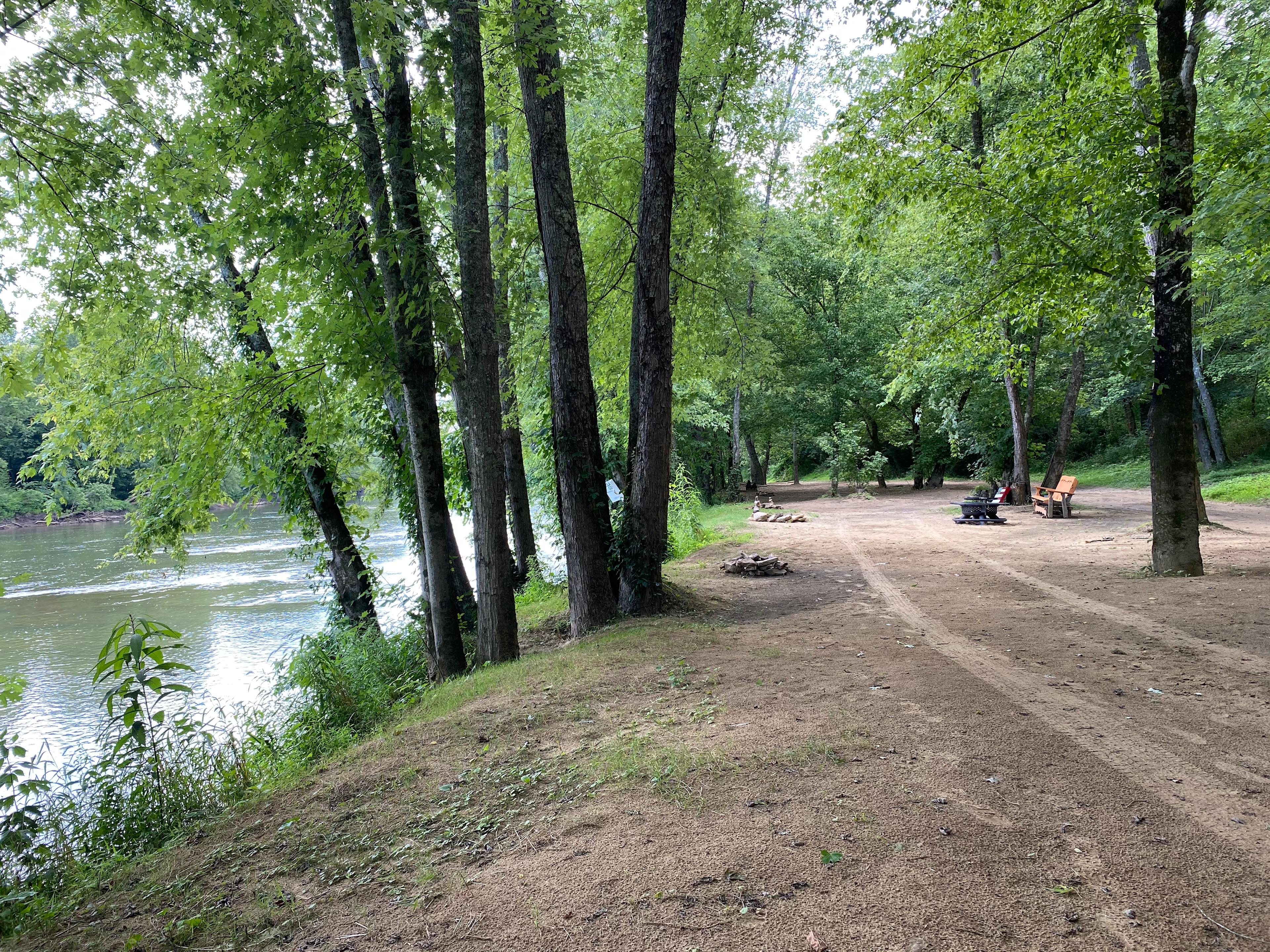 View down the riverbank overlooking campsites
Standing at Hammock hanger