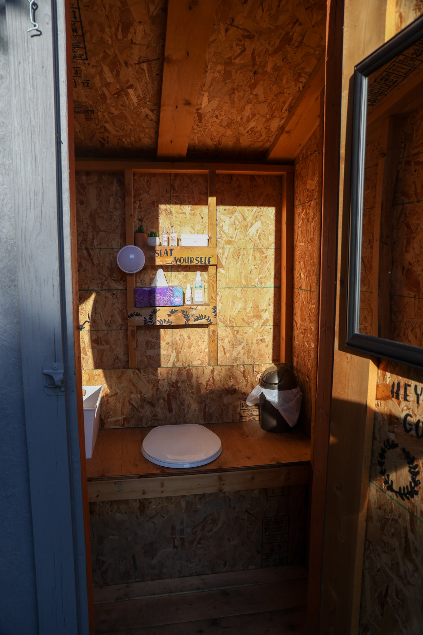 An outhouse that truly has it all.