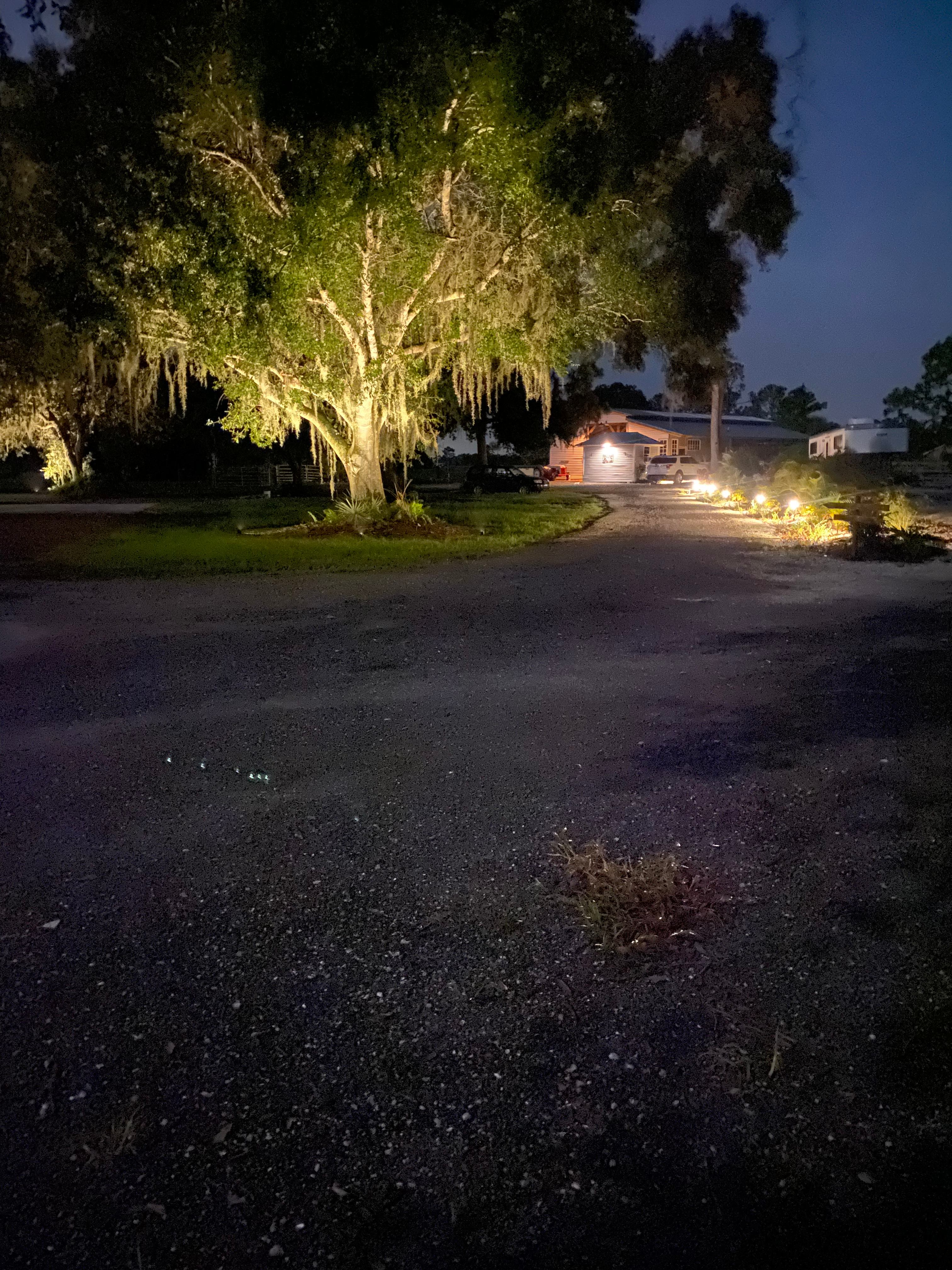 Landscape lighting at night. Some of the driveway, barn, and around the house. No lighting at the campsites 