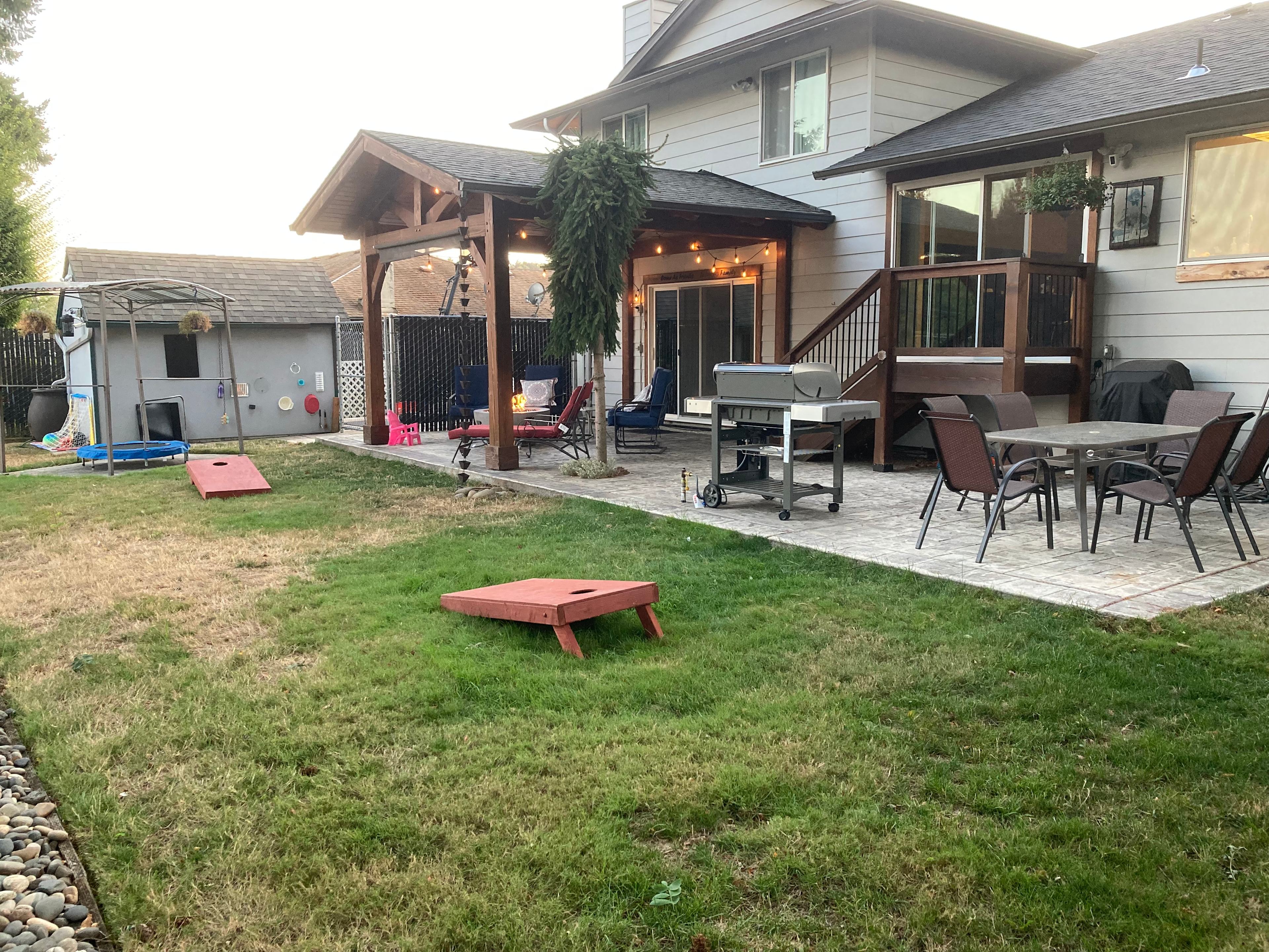 Shared backyard space includes patio table with 6 chairs, natural gas grill, natural gas fire pit with lounge chairs. 