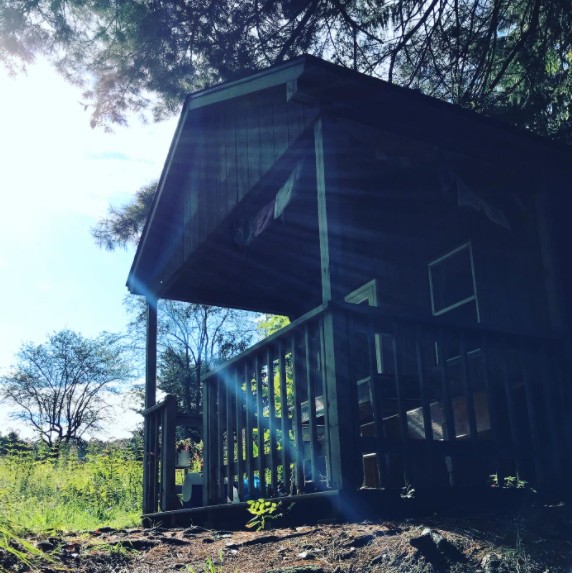 View of little cabin from stream..