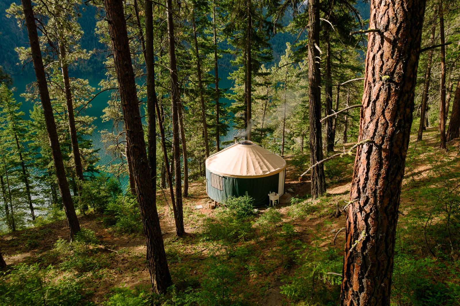 One of our Yurt's, nestled on a forest bench overlooking the lake