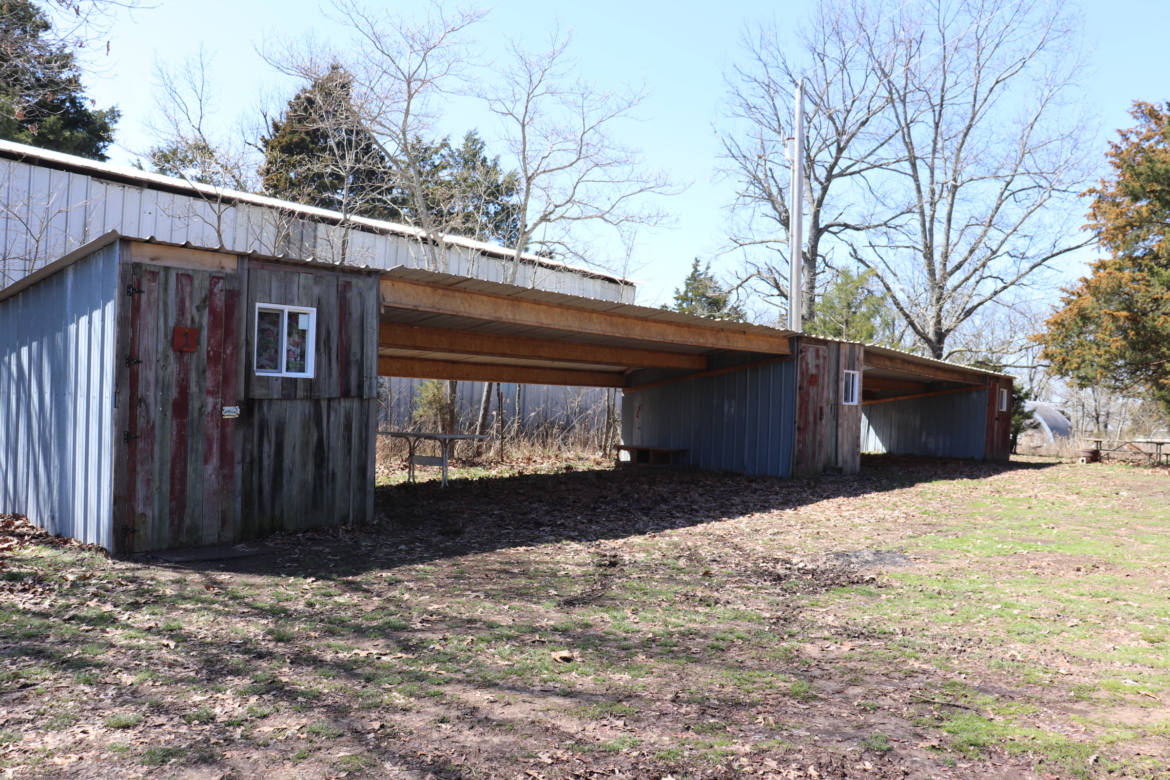 Covered areas between cabins for parking atv's, etc.