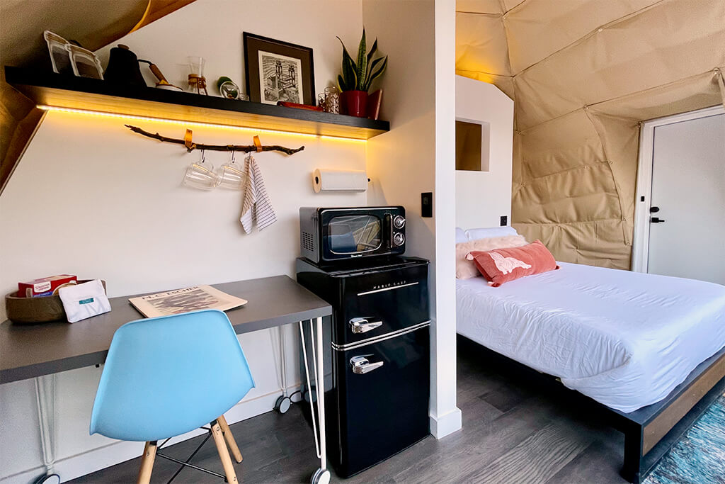 Kitchenette that houses a personal fridge and microwave, plus an inhouse coffee maker