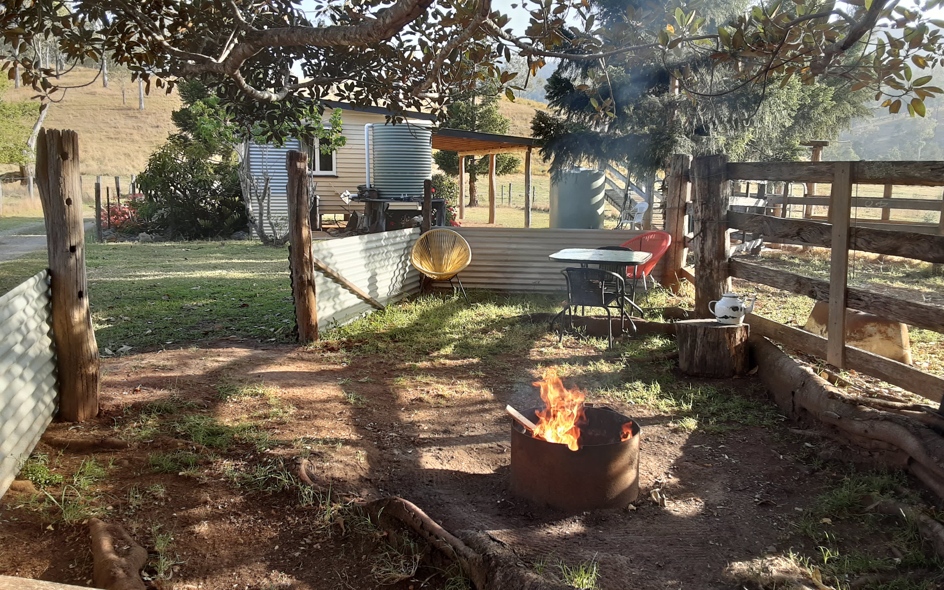 A view of the fire pit looking back onto the Cattleman's Cabin