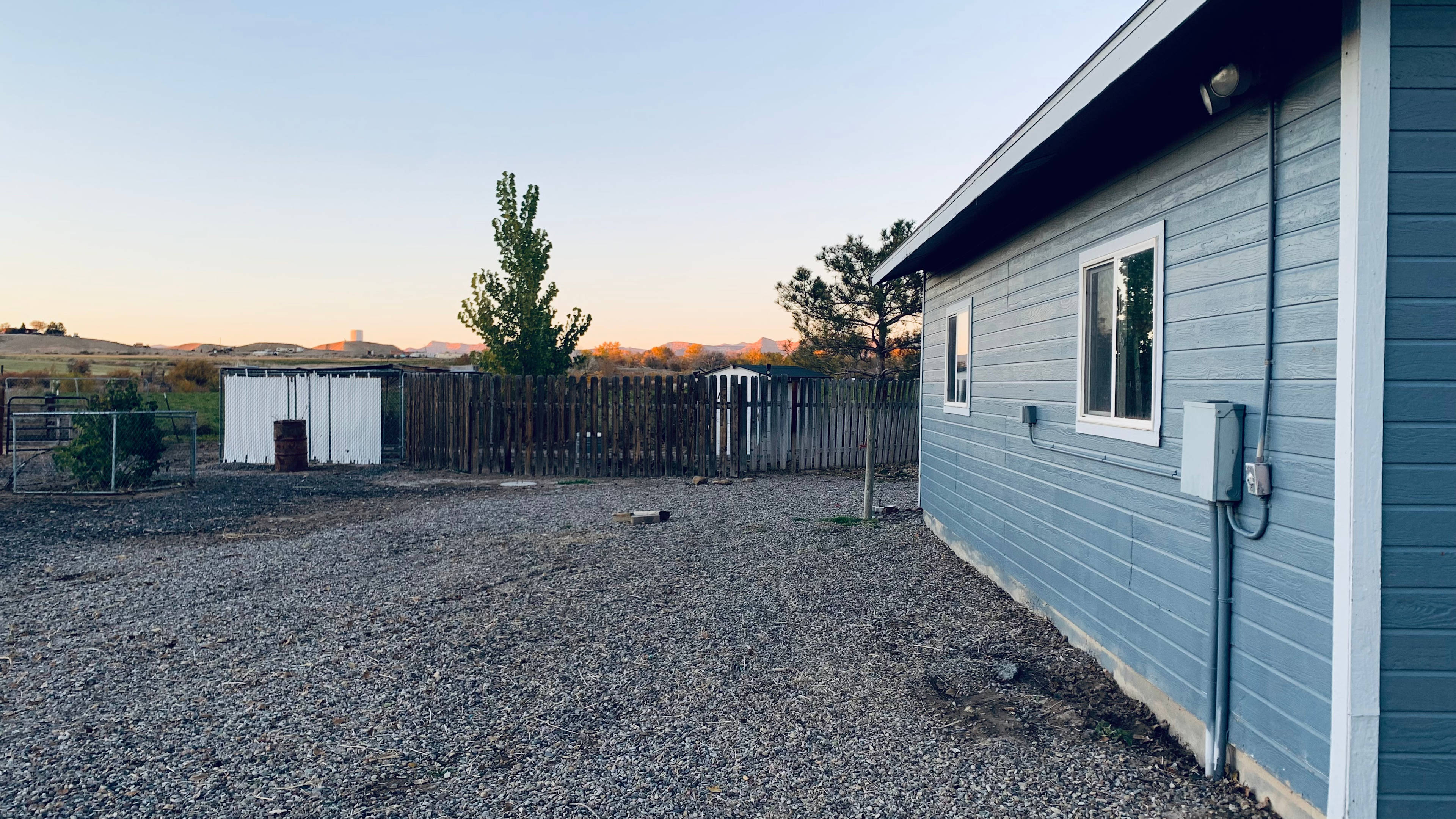 Camper parking Spot. Camper will have access to city water hookup and 30 amp electric next to garage. 